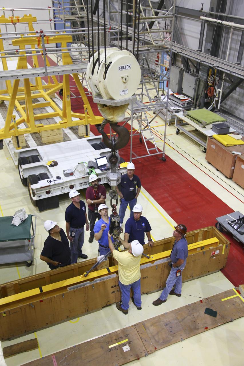 CAPE CANAVERAL, Fla. – In Orbiter Processing Facility-2 at NASA's Kennedy Space Center in Florida, United Space Alliance technicians prepare a crane to remove the airlock from space shuttle Endeavour’s payload bay. The airlock was the connecting point between the shuttle and the International Space Station. Endeavour is being prepared for public display at the California Science Center in Los Angeles. Over the course of its 19-year career, Endeavour spent 299 days in space during 25 missions. For more information, visit http://www.nasa.gov/transition. Photo credit: NASA/Frankie Martin