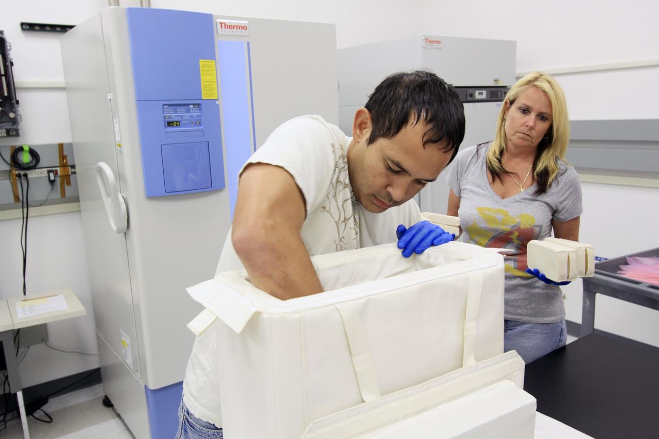 CAPE CANAVERAL, Fla. – In the Space Station Processing Facility at NASA’s Kennedy Space Center in Florida, the NanoRacks-CubeLabs Module-9 experiments requiring refrigeration are placed in a cargo bag designed to keep its contents cool. The module’s experiments requiring cold stowage are being prepared for transport to Space Launch Complex-40 on nearby Cape Canaveral Air Force Station.    There, the bags will be loaded into the Space Exploration Technologies Dragon capsule in preparation for its scheduled April 30 liftoff aboard a Falcon 9 rocket. NanoRacks-CubeLabs Module-9 uses a two-cube unit box for student competition investigations using 15 liquid mixing tube assemblies that function similar to commercial glow sticks. The investigations range from microbial growth to water purification in microgravity. Known as SpaceX, the launch will be the company's second demonstration test flight for NASA's Commercial Orbital Transportation Services program, or COTS. During the flight, the capsule will conduct a series of check-out procedures to test and prove its systems, including rendezvous and berthing with the International Space Station. If the capsule performs as planned, the module and other cargo will be transferred to the station. The cargo includes food, water and provisions for the station’s Expedition crews, such as clothing, batteries and computer equipment. Under COTS, NASA has partnered with two private companies to launch cargo safely to the station. For more information, visit http://www.nasa.gov/spacex.  Photo credit: NASA/Jim Grossmann