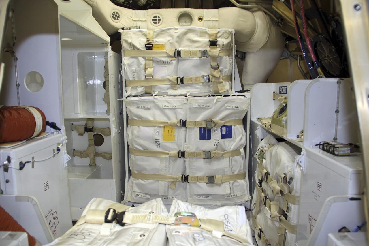 CAPE CANAVERAL, Fla. – In a processing hangar at Space Launch Complex-40 on Cape Canaveral Air Force Station in Florida, cargo has been stowed in the Space Exploration Technologies Dragon capsule in preparation for its scheduled April 30 liftoff aboard a Falcon 9 rocket.    Known as SpaceX, the launch will be the company's second demonstration test flight for NASA's Commercial Orbital Transportation Services program, or COTS. During the flight, the capsule will conduct a series of checkout procedures to test and prove its systems, including rendezvous and berthing with the International Space Station. The cargo includes food and provisions for the station’s Expedition crews, such as clothing, batteries, and computer equipment. Under COTS, NASA has partnered with two private companies to launch cargo safely to the station. For more information, visit http://www.nasa.gov/spacex.  Photo credit: NASA/Jim Grossmann