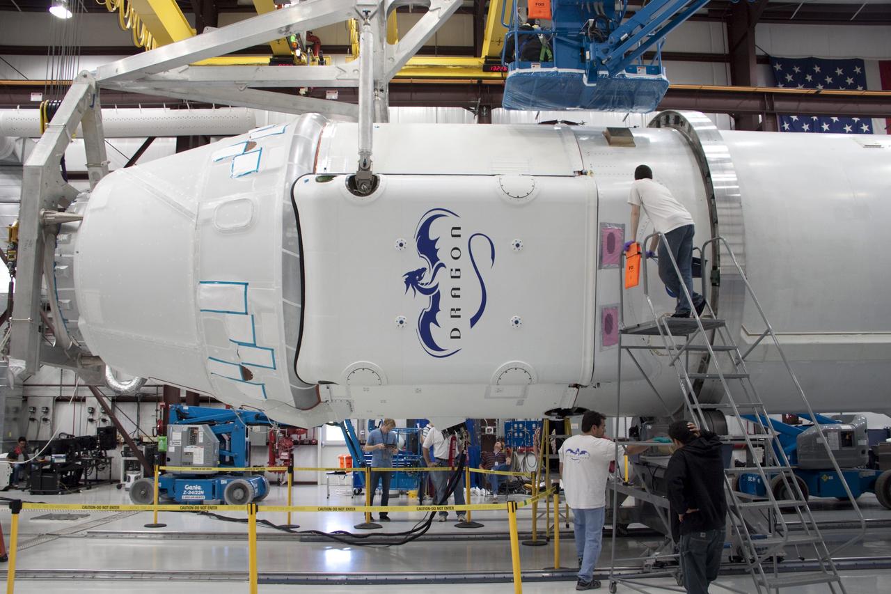 CAPE CANAVERAL, Fla. – In a processing facility at Space Launch Complex-40 on Cape Canaveral Air Force Station in Florida, operations are under way to mate the Space Exploration Technologies Dragon capsule to the second stage of the company’s Falcon 9 rocket. Known as SpaceX, the launch will be the company's second demonstration test flight for NASA's Commercial Orbital Transportation Services program, or COTS. During the flight, the capsule will conduct a series of check-out procedures to test and prove its systems, including rendezvous and berthing with the International Space Station. If the capsule performs as planned, the NanoRacks-CubeLabs Module-9 experiments and other cargo aboard Dragon will be transferred to the station. The cargo includes food, water and provisions for the station’s Expedition crews, such as clothing, batteries and computer equipment. Under COTS, NASA has partnered with two private companies to provide resupply missions to the station. The launch is scheduled for 9:38 a.m. EDT on May 7. For more information, visit http://www.nasa.gov/spacex. Photo credit: NASA/Jim Grossmann