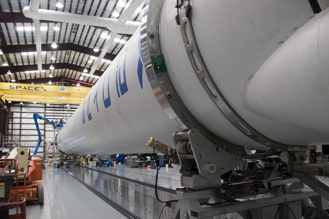 CAPE CANAVERAL, Fla. – In a processing facility at Space Launch Complex-40 on Cape Canaveral Air Force Station in Florida, mating of the Space Exploration Technologies Dragon capsule to the second stage of the company’s Falcon 9 rocket is nearly complete. Known as SpaceX, the launch will be the company's second demonstration test flight for NASA's Commercial Orbital Transportation Services program, or COTS. During the flight, the capsule will conduct a series of check-out procedures to test and prove its systems, including rendezvous and berthing with the International Space Station. If the capsule performs as planned, the NanoRacks-CubeLabs Module-9 experiments and other cargo aboard Dragon will be transferred to the station. The cargo includes food, water and provisions for the station’s Expedition crews, such as clothing, batteries and computer equipment. Under COTS, NASA has partnered with two private companies to provide resupply missions to the station. The launch is scheduled for 9:38 a.m. EDT on May 7. For more information, visit http://www.nasa.gov/spacex. Photo credit: NASA/Jim Grossmann