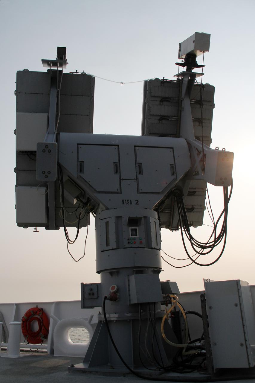CAPE CANAVERAL, Fla. – NASA’s Mobile Aerospace Reconnaissance System, or MARS, is secured aboard NASA’s Freedom Star boat as it is being prepared for a day of testing after departing from Port Canaveral in Florida for the Atlantic Ocean.    MARS, run by NASA’s Langley Research Center in Hampton, Va., with its spatial, hyperspectral, thermal, and directed energy capabilities will be used for thermal imaging testing for the upcoming SpaceX Falcon 9 and Dragon capsule test flight to the International Space Station. During today’s test, the MARS X-band radar and kineto tracking mount KTM were tested to ensure that they were synchronized to receive a rocket launch feed. The radar was used to identify an object to see if the KTM could lock on to and track it. The MARS team performed maintenance on the system, confirmed communications links, and tested the design of the mounting system and environmental enclosure. Photo credit: NASA/Cory Huston