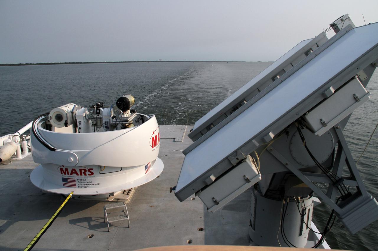 CAPE CANAVERAL, Fla. – NASA’s Freedom Star boat heads for the open waters of the Atlantic Ocean after departing from Port Canaveral in Florida. NASA’s Mobile Aerospace Reconnaissance System, or MARS, is secured aboard Freedom Star for a day of testing.    MARS, run by NASA’s Langley Research Center in Hampton, Va., with its spatial, hyperspectral, thermal, and directed energy capabilities will be used for thermal imaging testing for the upcoming SpaceX Falcon 9 and Dragon capsule test flight to the International Space Station. During today’s test, the MARS X-band radar and kineto tracking mount KTM were tested to ensure that they were synchronized to receive a rocket launch feed. The radar was used to identify an object to see if the KTM could lock on to and track it. The MARS team performed maintenance on the system, confirmed communications links, and tested the design of the mounting system and environmental enclosure. Photo credit: NASA/Cory Huston