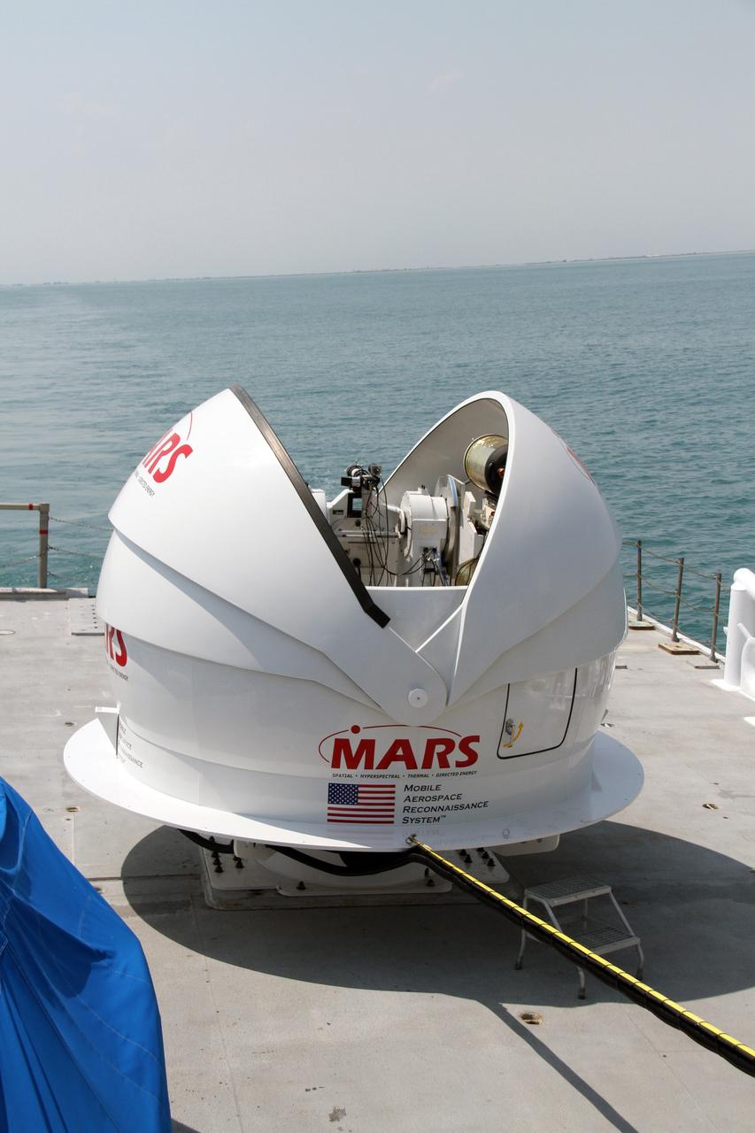 CAPE CANAVERAL, Fla. – NASA’s Mobile Aerospace Reconnaissance System, or MARS, is secured aboard NASA’s Freedom Star boat as it is being prepared for a day of testing after departing from Port Canaveral in Florida for the Atlantic Ocean.     MARS, run by NASA’s Langley Research Center in Hampton, Va., with its spatial, hyperspectral, thermal, and directed energy capabilities will be used for thermal imaging testing for the upcoming SpaceX Falcon 9 and Dragon capsule test flight to the International Space Station. During today’s test, the MARS X-band radar and kineto tracking mount KTM were tested to ensure that they were synchronized to receive a rocket launch feed. The radar was used to identify an object to see if the KTM could lock on to and track it. The MARS team performed maintenance on the system, confirmed communications links, and tested the design of the mounting system and environmental enclosure. Photo credit: NASA/Cory Huston