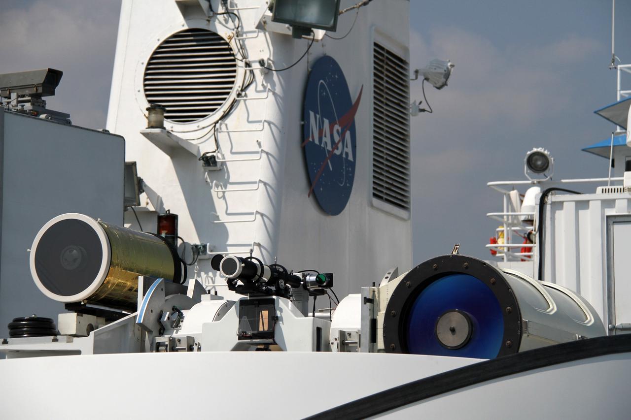 CAPE CANAVERAL, Fla. – Aboard NASA’s Freedom Star boat in the Atlantic Ocean off the coast of Port Canaveral in Florida, NASA’s Mobile Aerospace Reconnaissance System, or MARS, is being tested.      MARS, run by NASA’s Langley Research Center in Hampton, Va., with its spatial, hyperspectral, thermal, and directed energy capabilities will be used for thermal imaging testing for the upcoming SpaceX Falcon 9 and Dragon capsule test flight to the International Space Station. During today’s test, the MARS X-band radar and kineto tracking mount KTM were tested to ensure that they were synchronized to receive a rocket launch feed. The radar was used to identify an object to see if the KTM could lock on to and track it. The MARS team performed maintenance on the system, confirmed communications links, and tested the design of the mounting system and environmental enclosure. Photo credit: NASA/Cory Huston