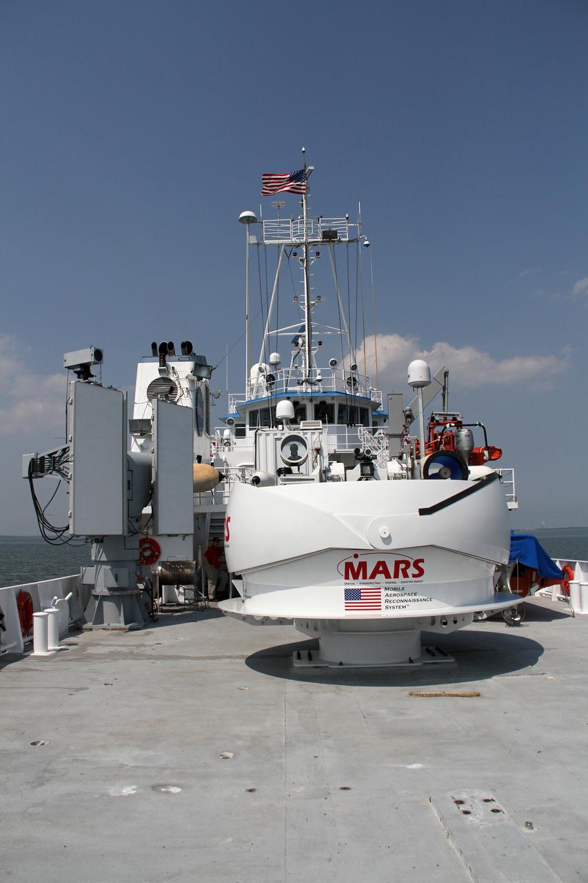 CAPE CANAVERAL, Fla. – Aboard NASA’s Freedom Star boat in the Atlantic Ocean off the coast of Port Canaveral in Florida, NASA’s Mobile Aerospace Reconnaissance System, or MARS, is being tested.      MARS, run by NASA’s Langley Research Center in Hampton, Va., with its spatial, hyperspectral, thermal, and directed energy capabilities will be used for thermal imaging testing for the upcoming SpaceX Falcon 9 and Dragon capsule test flight to the International Space Station. During today’s test, the MARS X-band radar and kineto tracking mount KTM were tested to ensure that they were synchronized to receive a rocket launch feed. The radar was used to identify an object to see if the KTM could lock on to and track it. The MARS team performed maintenance on the system, confirmed communications links, and tested the design of the mounting system and environmental enclosure. Photo credit: NASA/Cory Huston