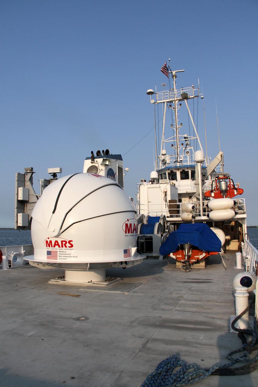 CAPE CANAVERAL, Fla. – NASA’s Freedom Star boat is heading back to Port Canaveral in Florida, after a full day of testing NASA’s Mobile Aerospace Reconnaissance System, or MARS, in the Atlantic Ocean.      MARS, run by NASA’s Langley Research Center in Hampton, Va., with its spatial, hyperspectral, thermal, and directed energy capabilities will be used for thermal imaging testing for the upcoming SpaceX Falcon 9 and Dragon capsule test flight to the International Space Station. During today’s test, the MARS X-band radar and kineto tracking mount KTM were tested to ensure that they were synchronized to receive a rocket launch feed. The radar was used to identify an object to see if the KTM could lock on to and track it. The MARS team performed maintenance on the system, confirmed communications links, and tested the design of the mounting system and environmental enclosure. Photo credit: NASA/Cory Huston