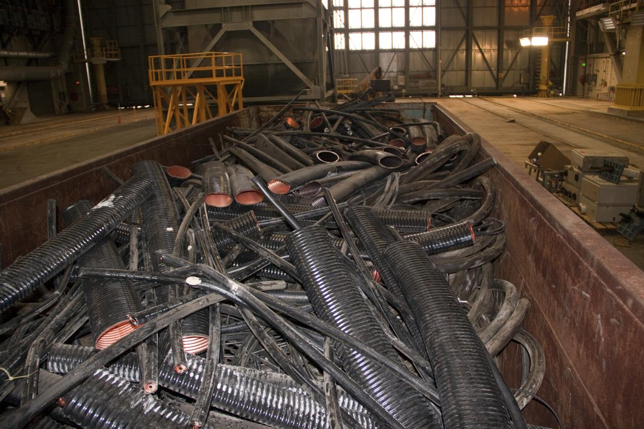 CAPE CANAVERAL, Fla. – At NASA’s Kennedy Space Center in Florida, old cabling is being pulled from high bay 3 in the Vehicle Assembly Building, or VAB, as part of a centerwide refurbishment initiative under the Ground Systems Development and Operations GSDO Program.    The cable replacement project is under way in high bays 1 and 3 on the east side of the building, facing Launch Complex 39’s pads A and B.  Approximately 150 miles of existing Apollo/shuttle era cabling is being removed to make room for installation of state-of-the-art command, communication and control systems that will be needed by future users to perform vehicle testing and verification prior to rollout to the launch pad.  For more information, visit http://go.nasa.gov/groundsystems.  Photo credit: NASA/Jim Grossmann