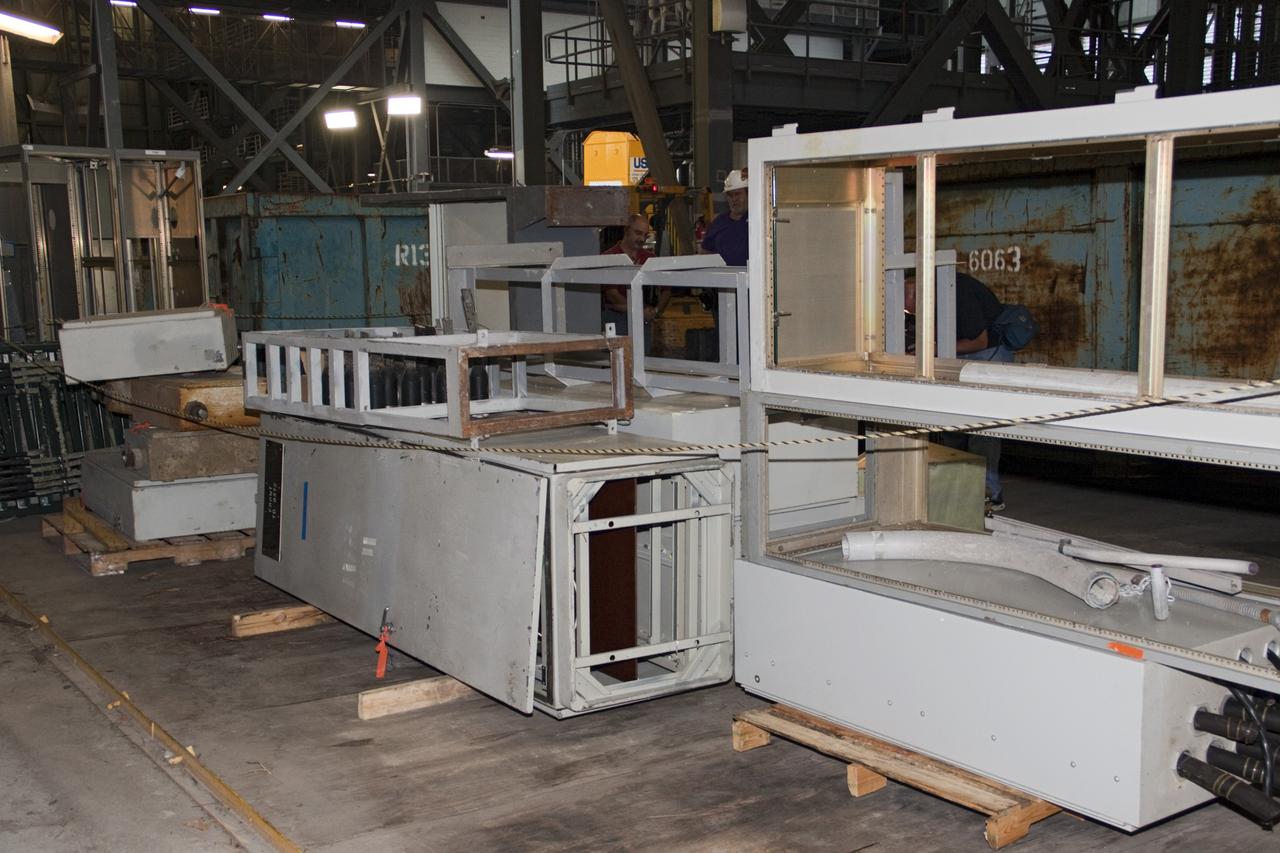 CAPE CANAVERAL, Fla. – At NASA’s Kennedy Space Center in Florida, old racks are being excessed in high bay 3 in the Vehicle Assembly Building, or VAB, as part of a centerwide refurbishment initiative under the Ground Systems Development and Operations GSDO Program      The cable replacement project is under way in high bays 1 and 3 on the east side of the building, facing Launch Complex 39’s pads A and B.  Approximately 150 miles of existing Apollo/shuttle era cabling is being removed to make room for installation of state-of-the-art command, communication and control systems that will be needed by future users to perform vehicle testing and verification prior to rollout to the launch pad.  For more information, visit http://go.nasa.gov/groundsystems.  Photo credit: NASA/Jim Grossmann