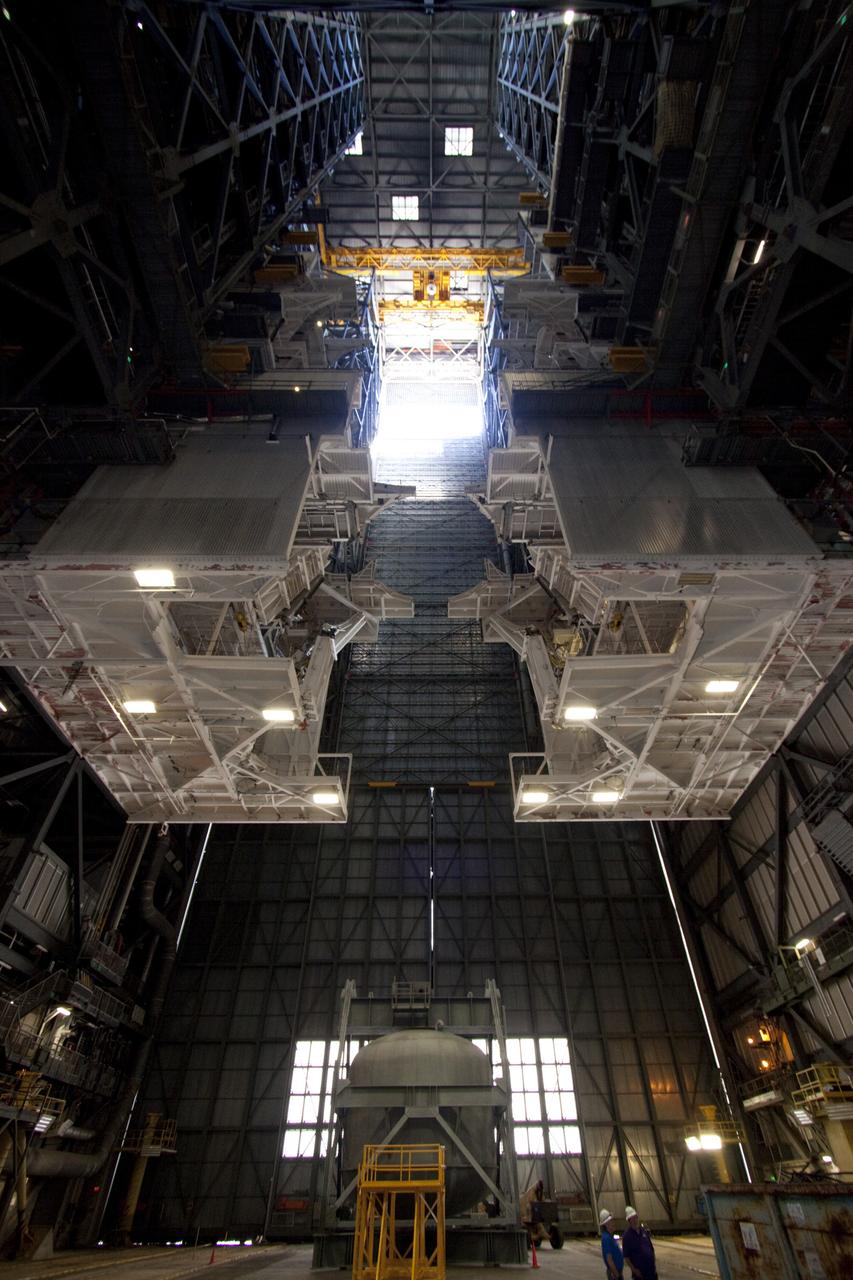 CAPE CANAVERAL, Fla. – At NASA’s Kennedy Space Center in Florida, refurbishment of high bay 3 is under way in the Vehicle Assembly Building, or VAB, as part of a centerwide refurbishment initiative under the Ground Systems Development and Operations GSDO Program.  It is 525 feet from the bay’s ceiling to the floor.         The cable replacement project is under way in high bays 1 and 3 on the east side of the building, facing Launch Complex 39’s pads A and B.  Approximately 150 miles of existing Apollo/shuttle era cabling is being removed to make room for installation of state-of-the-art command, communication and control systems that will be needed by future users to perform vehicle testing and verification prior to rollout to the launch pad.  For more information, visit http://go.nasa.gov/groundsystems.  Photo credit: NASA/Jim Grossmann