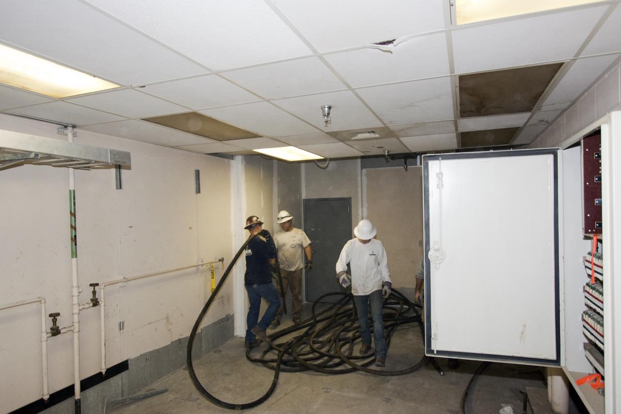 CAPE CANAVERAL, Fla. – At NASA’s Kennedy Space Center in Florida, workers remove cables between the 26th and 29th floors of high bay 3 in the 525-foot-tall Vehicle Assembly Building, or VAB, during part of a centerwide refurbishment initiative under the Ground Systems Development and Operations GSDO Program.       The cable replacement project is under way in high bays 1 and 3 on the east side of the building, facing Launch Complex 39’s pads A and B.  Approximately 150 miles of existing Apollo/shuttle era cabling is being removed to make room for installation of state-of-the-art command, communication and control systems that will be needed by future users to perform vehicle testing and verification prior to rollout to the launch pad.  For more information, visit http://go.nasa.gov/groundsystems.  Photo credit: NASA/Jim Grossmann