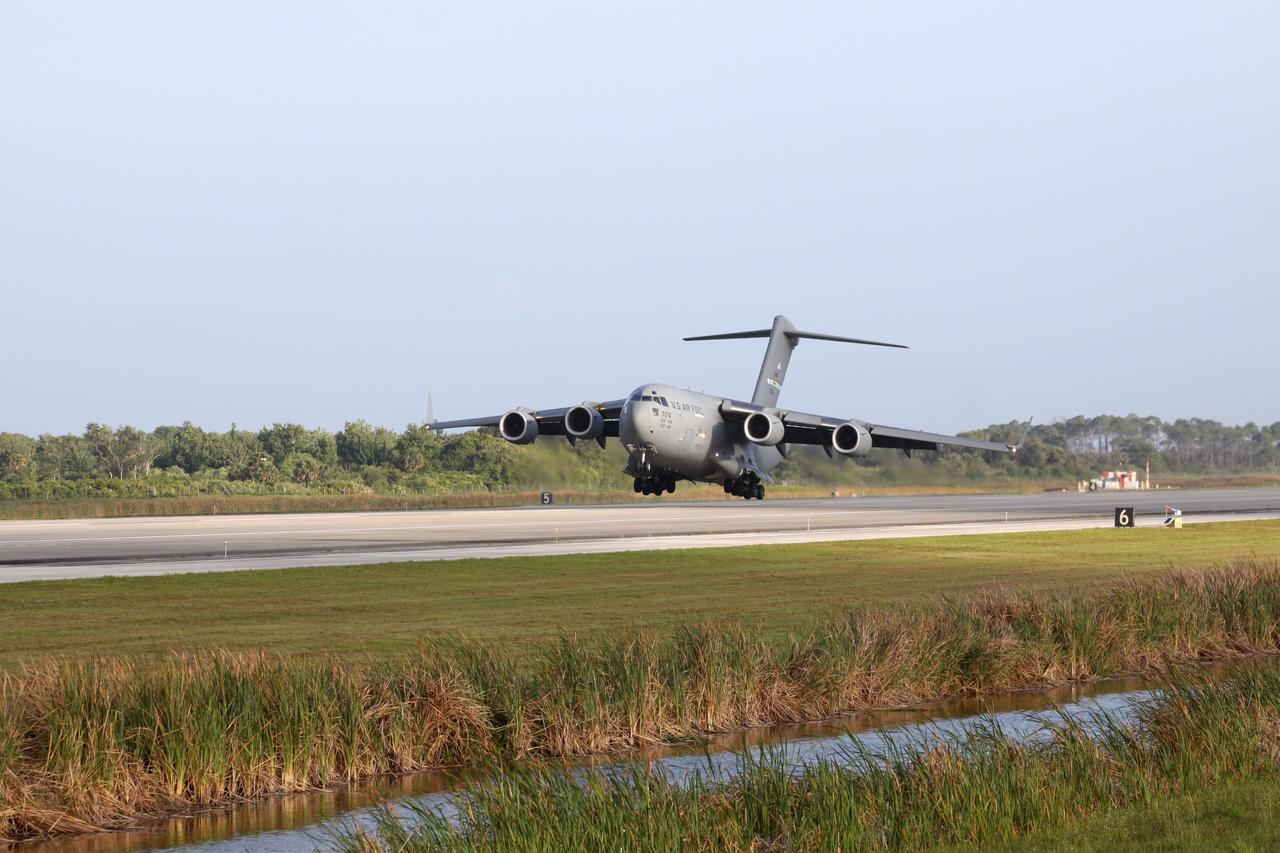 CAPE CANAVERAL, Fla. – A U.S. Air Force C-17 cargo aircraft nears landing at the Shuttle Landing Facility at NASA’s Kennedy Space Center in Florida. Aboard are NASA's twin Radiation Belt Storm Probes. The RBSP mission will help us understand the sun’s influence on Earth and near-Earth space by studying the Earth’s radiation belts on various scales of space and time. The RBSP instruments will provide the measurements needed to characterize and quantify the plasma processes that produce very energetic ions and relativistic electrons. The mission is part of NASA’s broader Living With a Star Program that was conceived to explore fundamental processes that operate throughout the solar system, and in particular those that generate hazardous space weather effects in the vicinity of Earth and phenomena that could impact solar system exploration. RBSP is scheduled to begin its mission of exploration of Earth's Van Allen Radiation Belts and the extremes of space weather after launch. Launch aboard a United Launch Alliance Atlas V rocket is scheduled for August 23. For more information, visit http://www.nasa.gov/rbsp. Photo credit: NASA/Kim Shiflett