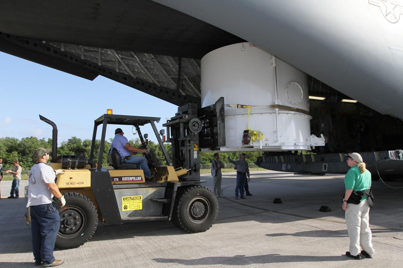 CAPE CANAVERAL, Fla. – A forklift is enlisted to lower NASA's Radiation Belt Storm Probe B, enclosed in a protective shipping container, from the cargo bay of a U.S. Air Force C-17 airplane to the tarmac at the Shuttle Landing Facility at NASA’s Kennedy Space Center in Florida. The RBSP mission will help us understand the sun’s influence on Earth and near-Earth space by studying the Earth’s radiation belts on various scales of space and time. The RBSP instruments will provide the measurements needed to characterize and quantify the plasma processes that produce very energetic ions and relativistic electrons. The mission is part of NASA’s broader Living With a Star Program that was conceived to explore fundamental processes that operate throughout the solar system, and in particular those that generate hazardous space weather effects in the vicinity of Earth and phenomena that could impact solar system exploration. RBSP is scheduled to begin its mission of exploration of Earth's Van Allen Radiation Belts and the extremes of space weather after launch. Launch aboard a United Launch Alliance Atlas V rocket is scheduled for August 23. For more information, visit http://www.nasa.gov/rbsp. Photo credit: NASA/Kim Shiflett