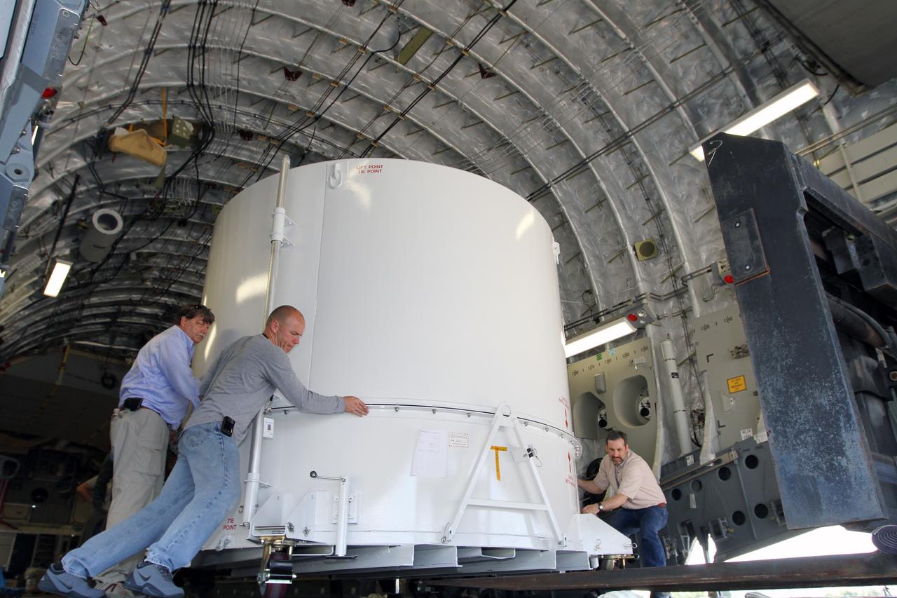 CAPE CANAVERAL, Fla. – Workers move NASA's Radiation Belt Storm Probe A, enclosed in a protective shipping container, to the end of the cargo bay of a U.S. Air Force C-17 airplane at the Shuttle Landing Facility at NASA’s Kennedy Space Center in Florida. The RBSP mission will help us understand the sun’s influence on Earth and near-Earth space by studying the Earth’s radiation belts on various scales of space and time. The RBSP instruments will provide the measurements needed to characterize and quantify the plasma processes that produce very energetic ions and relativistic electrons. The mission is part of NASA’s broader Living With a Star Program that was conceived to explore fundamental processes that operate throughout the solar system, and in particular those that generate hazardous space weather effects in the vicinity of Earth and phenomena that could impact solar system exploration. RBSP is scheduled to begin its mission of exploration of Earth's Van Allen Radiation Belts and the extremes of space weather after launch. Launch aboard a United Launch Alliance Atlas V rocket is scheduled for August 23. For more information, visit http://www.nasa.gov/rbsp. Photo credit: NASA/Kim Shiflett