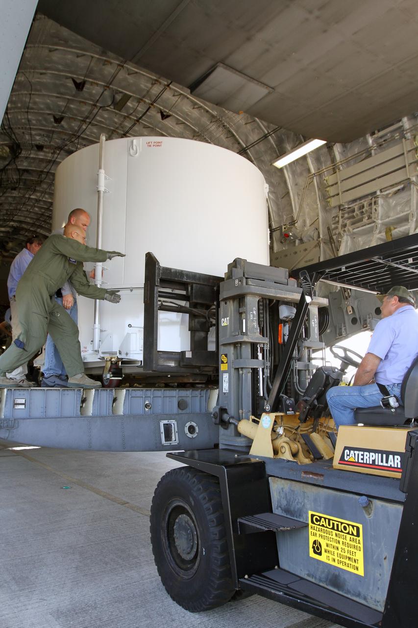 CAPE CANAVERAL, Fla. – NASA's Radiation Belt Storm Probe A, enclosed in a protective shipping container, is positioned at the end of the cargo bay of a U.S. Air Force C-17 airplane to be offloaded at the Shuttle Landing Facility at NASA’s Kennedy Space Center in Florida. The RBSP mission will help us understand the sun’s influence on Earth and near-Earth space by studying the Earth’s radiation belts on various scales of space and time. The RBSP instruments will provide the measurements needed to characterize and quantify the plasma processes that produce very energetic ions and relativistic electrons. The mission is part of NASA’s broader Living With a Star Program that was conceived to explore fundamental processes that operate throughout the solar system, and in particular those that generate hazardous space weather effects in the vicinity of Earth and phenomena that could impact solar system exploration. RBSP is scheduled to begin its mission of exploration of Earth's Van Allen Radiation Belts and the extremes of space weather after launch. Launch aboard a United Launch Alliance Atlas V rocket is scheduled for August 23. For more information, visit http://www.nasa.gov/rbsp. Photo credit: NASA/Kim Shiflett