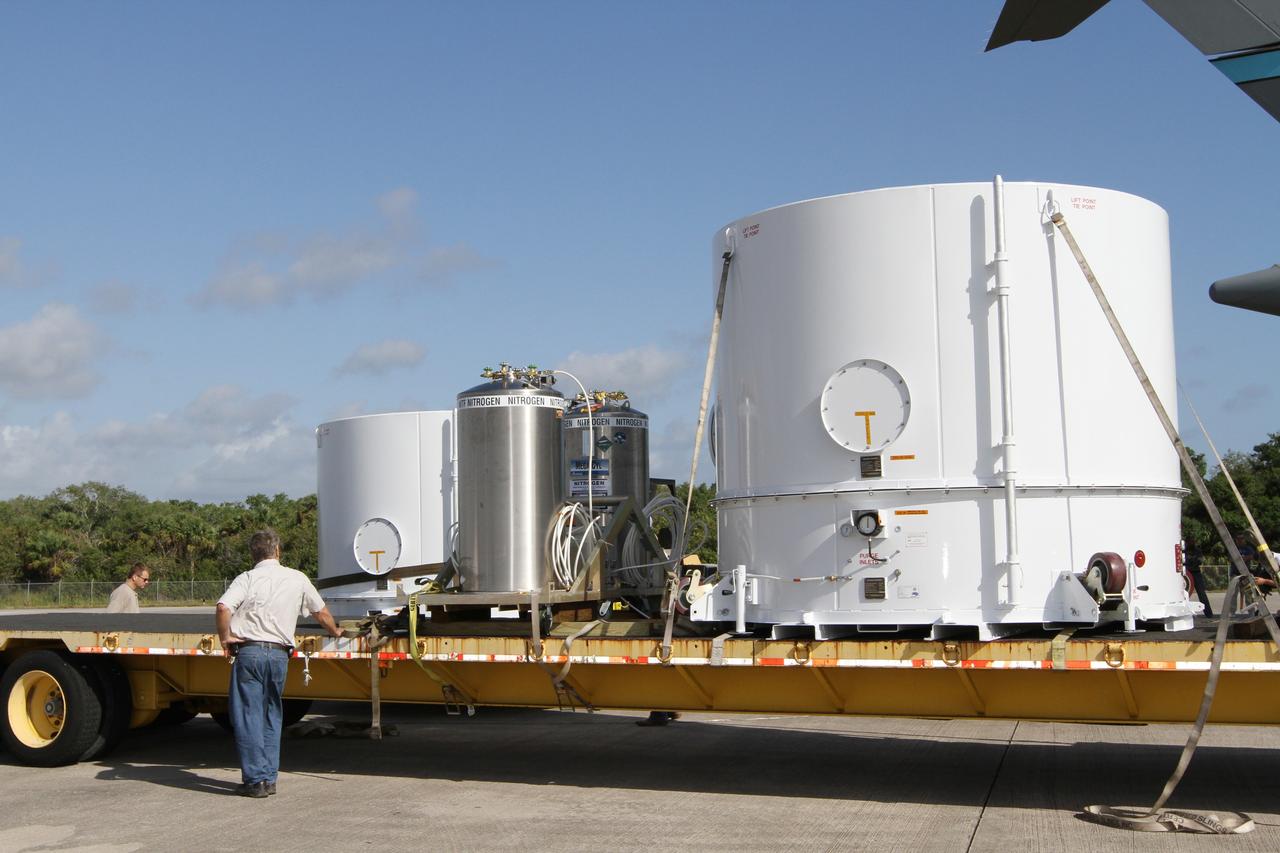 CAPE CANAVERAL, Fla. – Workers prepare to load NASA's Radiation Belt Storm Probe A, enclosed in a protective shipping container, onto a flatbed truck at the Shuttle Landing Facility at NASA’s Kennedy Space Center in Florida.  The twin RBSP spacecraft will be transported to the Astrotech payload processing facility near Kennedy Space Center where Applied Physics Laboratory technicians will begin spacecraft testing and prelaunch preparations. Nitrogen will be pumped into the canisters during transport to provide the proper environmental control for the spacecraft.            The RBSP mission will help us understand the sun’s influence on Earth and near-Earth space by studying the Earth’s radiation belts on various scales of space and time. The RBSP instruments will provide the measurements needed to characterize and quantify the plasma processes that produce very energetic ions and relativistic electrons. The mission is part of NASA’s broader Living With a Star Program that was conceived to explore fundamental processes that operate throughout the solar system, and in particular those that generate hazardous space weather effects in the vicinity of Earth and phenomena that could impact solar system exploration. RBSP is scheduled to begin its mission of exploration of Earth's Van Allen Radiation Belts and the extremes of space weather after launch. Launch aboard a United Launch Alliance Atlas V rocket is scheduled for August 23.  For more information, visit http://www.nasa.gov/rbsp.  Photo credit: NASA/Kim Shiflett