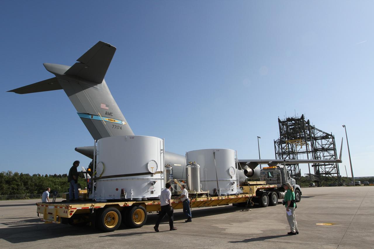 CAPE CANAVERAL, Fla. – Workers secure NASA's Radiation Belt Storm Probe A, enclosed in a protective shipping container, onto a flatbed truck at the Shuttle Landing Facility at NASA’s Kennedy Space Center in Florida.  The twin RBSP spacecraft will be transported to the Astrotech payload processing facility near Kennedy Space Center where Applied Physics Laboratory technicians will begin spacecraft testing and prelaunch preparations. Nitrogen will be pumped into the canisters during transport to provide the proper environmental control for the spacecraft.            The RBSP mission will help us understand the sun’s influence on Earth and near-Earth space by studying the Earth’s radiation belts on various scales of space and time. The RBSP instruments will provide the measurements needed to characterize and quantify the plasma processes that produce very energetic ions and relativistic electrons. The mission is part of NASA’s broader Living With a Star Program that was conceived to explore fundamental processes that operate throughout the solar system, and in particular those that generate hazardous space weather effects in the vicinity of Earth and phenomena that could impact solar system exploration. RBSP is scheduled to begin its mission of exploration of Earth's Van Allen Radiation Belts and the extremes of space weather after launch. Launch aboard a United Launch Alliance Atlas V rocket is scheduled for August 23.  For more information, visit http://www.nasa.gov/rbsp.  Photo credit: NASA/Kim Shiflett