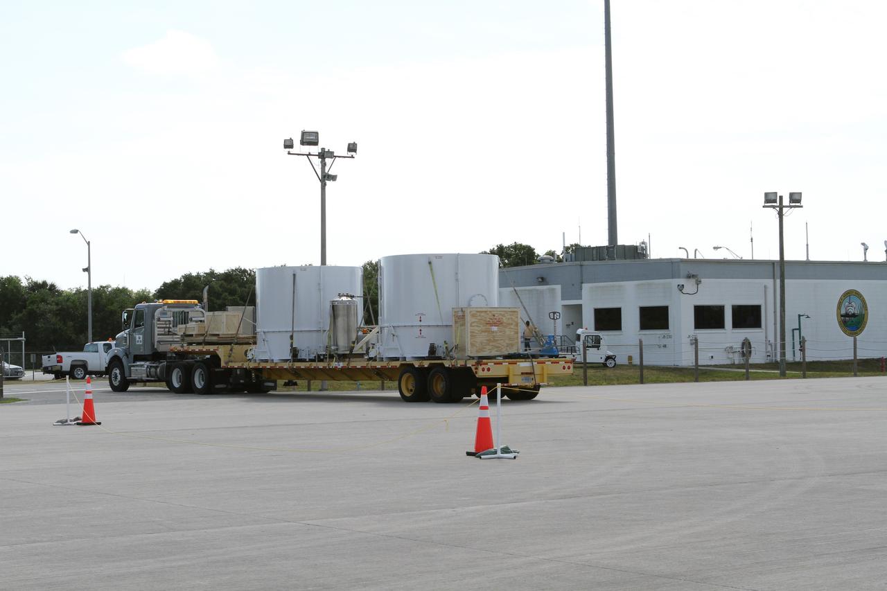 CAPE CANAVERAL, Fla. – NASA's twin Radiation Belt Storm Probes, enclosed in protective shipping containers, depart from the Shuttle Landing Facility at NASA’s Kennedy Space Center in Florida aboard a flatbed truck.  The spacecraft were delivered in the cargo bay of a U.S. Air Force C-17 aircraft earlier in the day and are on their way to the Astrotech payload processing facility near Kennedy Space Center where Applied Physics Laboratory technicians will begin spacecraft testing and prelaunch preparations.            The RBSP mission will help us understand the sun’s influence on Earth and near-Earth space by studying the Earth’s radiation belts on various scales of space and time. The RBSP instruments will provide the measurements needed to characterize and quantify the plasma processes that produce very energetic ions and relativistic electrons. The mission is part of NASA’s broader Living With a Star Program that was conceived to explore fundamental processes that operate throughout the solar system, and in particular those that generate hazardous space weather effects in the vicinity of Earth and phenomena that could impact solar system exploration. RBSP is scheduled to begin its mission of exploration of Earth's Van Allen Radiation Belts and the extremes of space weather after launch. Launch aboard a United Launch Alliance Atlas V rocket is scheduled for August 23.  For more information, visit http://www.nasa.gov/rbsp.  Photo credit: NASA/Kim Shiflett
