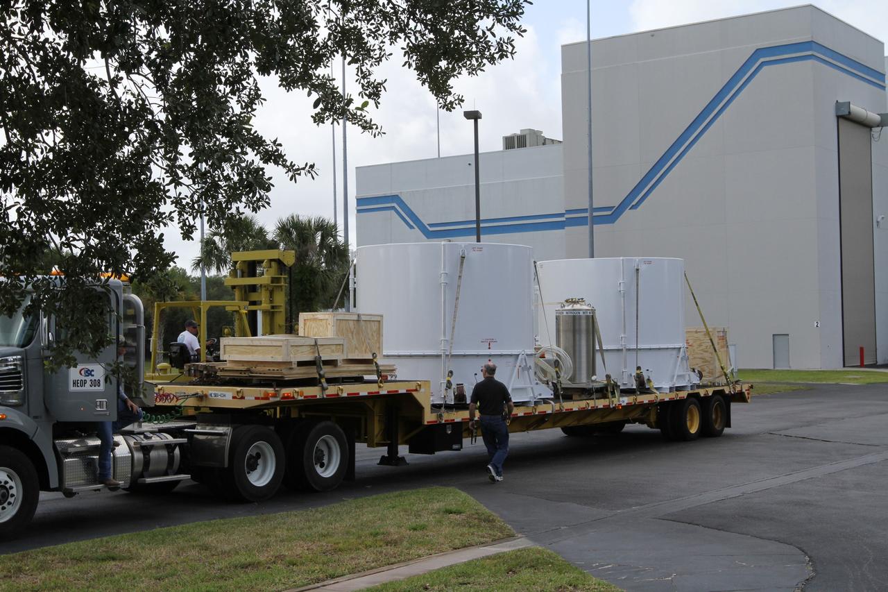CAPE CANAVERAL, Fla. – NASA's twin Radiation Belt Storm Probes, enclosed in protective shipping containers, arrive at the Astrotech payload processing facility near NASA’s Kennedy Space Center in Florida where Applied Physics Laboratory technicians will begin spacecraft testing and prelaunch preparations.  The spacecraft were delivered to Kennedy’s Shuttle Landing Facility in the cargo bay of a U.S. Air Force C-17 aircraft earlier in the day.             The RBSP mission will help us understand the sun’s influence on Earth and near-Earth space by studying the Earth’s radiation belts on various scales of space and time. The RBSP instruments will provide the measurements needed to characterize and quantify the plasma processes that produce very energetic ions and relativistic electrons. The mission is part of NASA’s broader Living With a Star Program that was conceived to explore fundamental processes that operate throughout the solar system, and in particular those that generate hazardous space weather effects in the vicinity of Earth and phenomena that could impact solar system exploration. RBSP is scheduled to begin its mission of exploration of Earth's Van Allen Radiation Belts and the extremes of space weather after launch. Launch aboard a United Launch Alliance Atlas V rocket is scheduled for August 23.  For more information, visit http://www.nasa.gov/rbsp.  Photo credit: NASA/Kim Shiflett