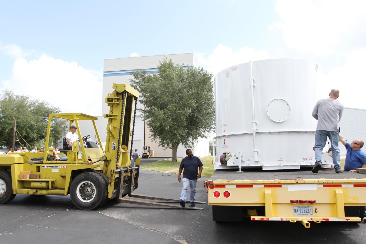 CAPE CANAVERAL, Fla. – Preparations are under way to offload NASA's twin Radiation Belt Storm Probes, enclosed in protective shipping containers, into the Astrotech payload processing facility near NASA’s Kennedy Space Center in Florida where Applied Physics Laboratory technicians will begin spacecraft testing and prelaunch preparations. The spacecraft arrived at Kennedy’s Shuttle Landing Facility in the cargo bay of a U.S. Air Force C-17 aircraft earlier in the day.            The RBSP mission will help us understand the sun’s influence on Earth and near-Earth space by studying the Earth’s radiation belts on various scales of space and time. The RBSP instruments will provide the measurements needed to characterize and quantify the plasma processes that produce very energetic ions and relativistic electrons. The mission is part of NASA’s broader Living With a Star Program that was conceived to explore fundamental processes that operate throughout the solar system, and in particular those that generate hazardous space weather effects in the vicinity of Earth and phenomena that could impact solar system exploration. RBSP is scheduled to begin its mission of exploration of Earth's Van Allen Radiation Belts and the extremes of space weather after launch. Launch aboard a United Launch Alliance Atlas V rocket is scheduled for August 23.  For more information, visit http://www.nasa.gov/rbsp.  Photo credit: NASA/Kim Shiflett