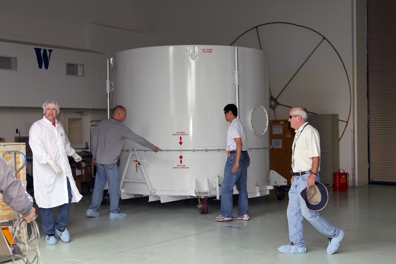 CAPE CANAVERAL, Fla. – NASA's Radiation Belt Storm Probe A, enclosed in a protective shipping container, is positioned into the airlock of the Astrotech payload processing facility near NASA’s Kennedy Space Center in Florida where Applied Physics Laboratory technicians will begin spacecraft testing and prelaunch preparations.  The twin RBSP spacecraft arrived at Kennedy’s Shuttle Landing Facility in the cargo bay of a U.S. Air Force C-17 aircraft earlier in the day.            The RBSP mission will help us understand the sun’s influence on Earth and near-Earth space by studying the Earth’s radiation belts on various scales of space and time. The RBSP instruments will provide the measurements needed to characterize and quantify the plasma processes that produce very energetic ions and relativistic electrons. The mission is part of NASA’s broader Living With a Star Program that was conceived to explore fundamental processes that operate throughout the solar system, and in particular those that generate hazardous space weather effects in the vicinity of Earth and phenomena that could impact solar system exploration. RBSP is scheduled to begin its mission of exploration of Earth's Van Allen Radiation Belts and the extremes of space weather after launch. Launch aboard a United Launch Alliance Atlas V rocket is scheduled for August 23.  For more information, visit http://www.nasa.gov/rbsp.  Photo credit: NASA/Kim Shiflett