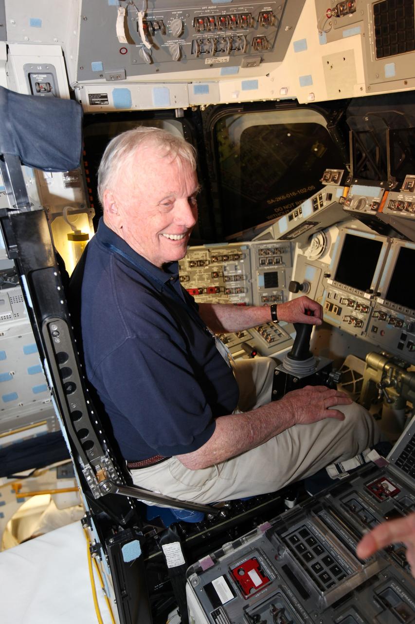CAPE CANAVERAL, Fla. – In Orbiter Processing Facility-1 at NASA's Kennedy Space Center in Florida, former NASA astronaut Neil Armstrong, who in 1969 became the first man to set foot on the moon, sits in the commander's seat of space shuttle Atlantis.     Atlantis is being prepared for display at the Kennedy Space Center Visitor Complex and is scheduled to rollover to the complex in November. The visitor complex is targeting a July 2012 grand opening for Atlantis’ new home.  Photo credit: NASA/Dimitri Gerondidakis