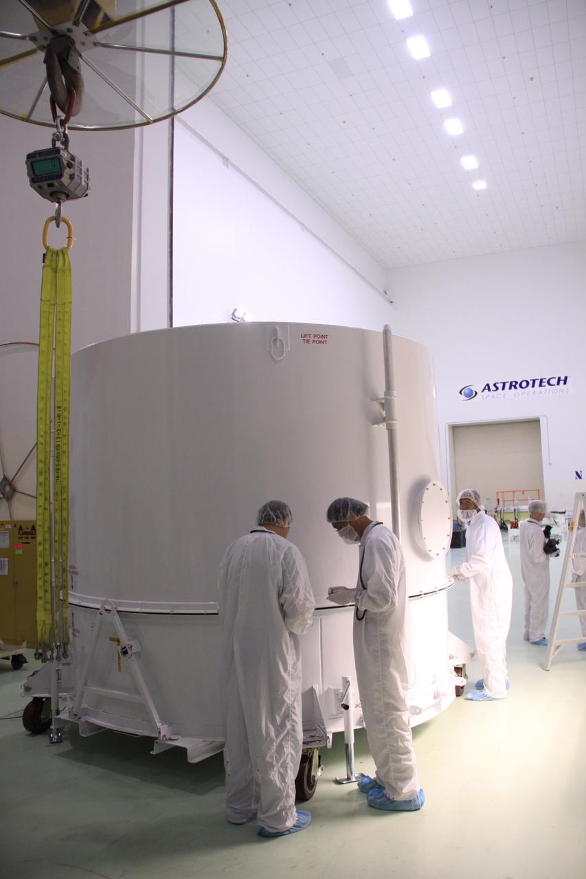 CAPE CANAVERAL, Fla. - In the clean room high bay at the Astrotech payload processing facility near NASA’s Kennedy Space Center in Florida, preparations are under way to remove the shipping container from around NASA's Radiation Belt Storm Probe A. Applied Physics Laboratory technicians then will begin prelaunch preparations and spacecraft testing.    The Radiation Belt Storm Probes, or RBSP, mission will help us understand the sun’s influence on Earth and near-Earth space by studying the Earth’s radiation belts on various scales of space and time. RBSP instruments will provide the measurements needed to characterize and quantify the plasma processes that produce very energetic ions and relativistic electrons. The mission is part of NASA’s broader Living With a Star Program that was conceived to explore fundamental processes that operate throughout the solar system, particularly those that generate hazardous space weather effects in the vicinity of Earth and phenomena that could impact solar system exploration. RBSP will begin its mission of exploration of Earth's Van Allen radiation belts and the extremes of space weather after launch. Launch aboard a United Launch Alliance Atlas V rocket is scheduled for August 23. For more information, visit http://www.nasa.gov/rbsp. Photo credit: NASA/Jim Grossmann