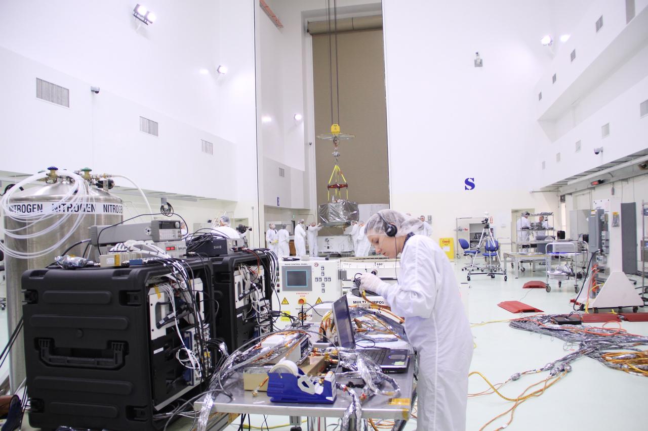 CAPE CANAVERAL, Fla. – In the clean room high bay at the Astrotech payload processing facility near NASA’s Kennedy Space Center in Florida, an Applied Physics Laboratory technician prepares the instruments and equipment that will be used to test and monitor NASA's Radiation Belt Storm Probes.      The Radiation Belt Storm Probes, or RBSP, mission will help us understand the sun’s influence on Earth and near-Earth space by studying the Earth’s radiation belts on various scales of space and time. RBSP instruments will provide the measurements needed to characterize and quantify the plasma processes that produce very energetic ions and relativistic electrons. The mission is part of NASA’s broader Living With a Star Program that was conceived to explore fundamental processes that operate throughout the solar system, particularly those that generate hazardous space weather effects in the vicinity of Earth and phenomena that could impact solar system exploration. RBSP will begin its mission of exploration of Earth's Van Allen radiation belts and the extremes of space weather after launch. Launch aboard a United Launch Alliance Atlas V rocket is scheduled for August 23. For more information, visit http://www.nasa.gov/rbsp. Photo credit: NASA/Jim Grossmann