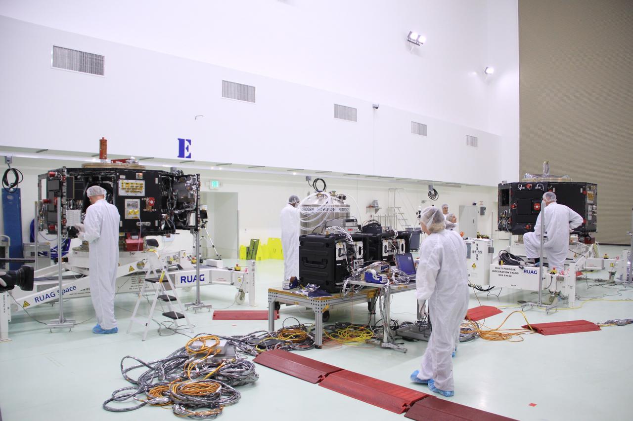 CAPE CANAVERAL, Fla. – In the clean room high bay at the Astrotech payload processing facility near NASA’s Kennedy Space Center in Florida, Applied Physics Laboratory technicians prepare to connect NASA's twin Radiation Belt Storm Probes to instruments and equipment that will be used to test and monitor them.      The Radiation Belt Storm Probes, or RBSP, mission will help us understand the sun’s influence on Earth and near-Earth space by studying the Earth’s radiation belts on various scales of space and time. RBSP instruments will provide the measurements needed to characterize and quantify the plasma processes that produce very energetic ions and relativistic electrons. The mission is part of NASA’s broader Living With a Star Program that was conceived to explore fundamental processes that operate throughout the solar system, particularly those that generate hazardous space weather effects in the vicinity of Earth and phenomena that could impact solar system exploration. RBSP will begin its mission of exploration of Earth's Van Allen radiation belts and the extremes of space weather after launch. Launch aboard a United Launch Alliance Atlas V rocket is scheduled for August 23. For more information, visit http://www.nasa.gov/rbsp. Photo credit: NASA/Jim Grossmann