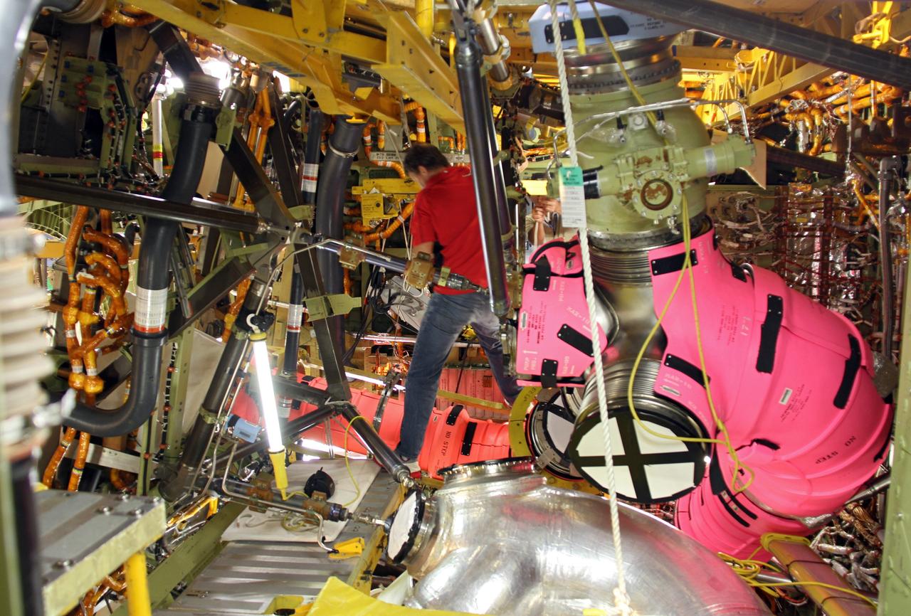 CAPE CANAVERAL, Fla. – In Orbiter Processing Facility-1 at NASA’s Kennedy Space Center in Florida, the camera catches a glimpse of the complex infrastructure in space shuttle Atlantis’ aft compartment as operations get under way to remove one of three fuel lines that supplied liquid hydrogen propellant to Atlantis’ main engines. The liquid hydrogen lines will be placed in storage to preserve the option to reuse them on NASA’s Space Launch System heavy-lift vehicle, under development. The work is part of the Space Shuttle Program’s transition and retirement processing of shuttle Atlantis. A groundbreaking was held Jan. 18 for Atlantis' future home, a 65,000-square-foot exhibit hall in Shuttle Plaza at the Kennedy Space Center Visitor Complex. Atlantis is scheduled to roll over to the visitor complex in November in preparation for the exhibit’s grand opening in July 2013. For more information, visit http://www.nasa.gov/shuttle. Photo credit: NASA/Ben Smegelsky