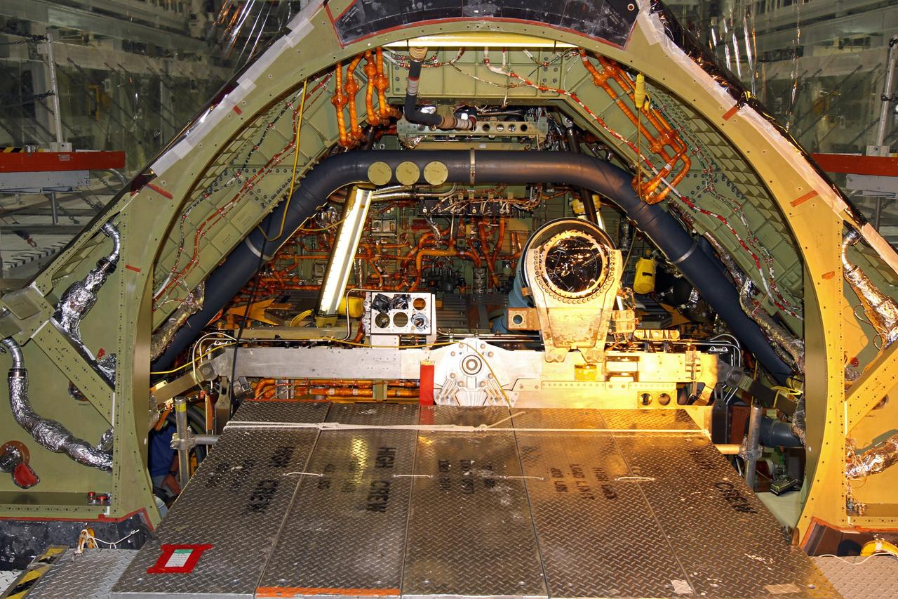 CAPE CANAVERAL, Fla. – In Orbiter Processing Facility-1 at NASA’s Kennedy Space Center in Florida, space shuttle Atlantis’ engine well is empty where main engine No. 1 has been removed. The liquid hydrogen lines will be placed in storage to preserve the option to reuse them on NASA’s Space Launch System heavy-lift vehicle, under development. The work is part of the Space Shuttle Program’s transition and retirement processing of shuttle Atlantis. A groundbreaking was held Jan. 18 for Atlantis' future home, a 65,000-square-foot exhibit hall in Shuttle Plaza at the Kennedy Space Center Visitor Complex. Atlantis is scheduled to roll over to the visitor complex in November in preparation for the exhibit’s grand opening in July 2013. For more information, visit http://www.nasa.gov/shuttle. Photo credit: NASA/Ben Smegelsky