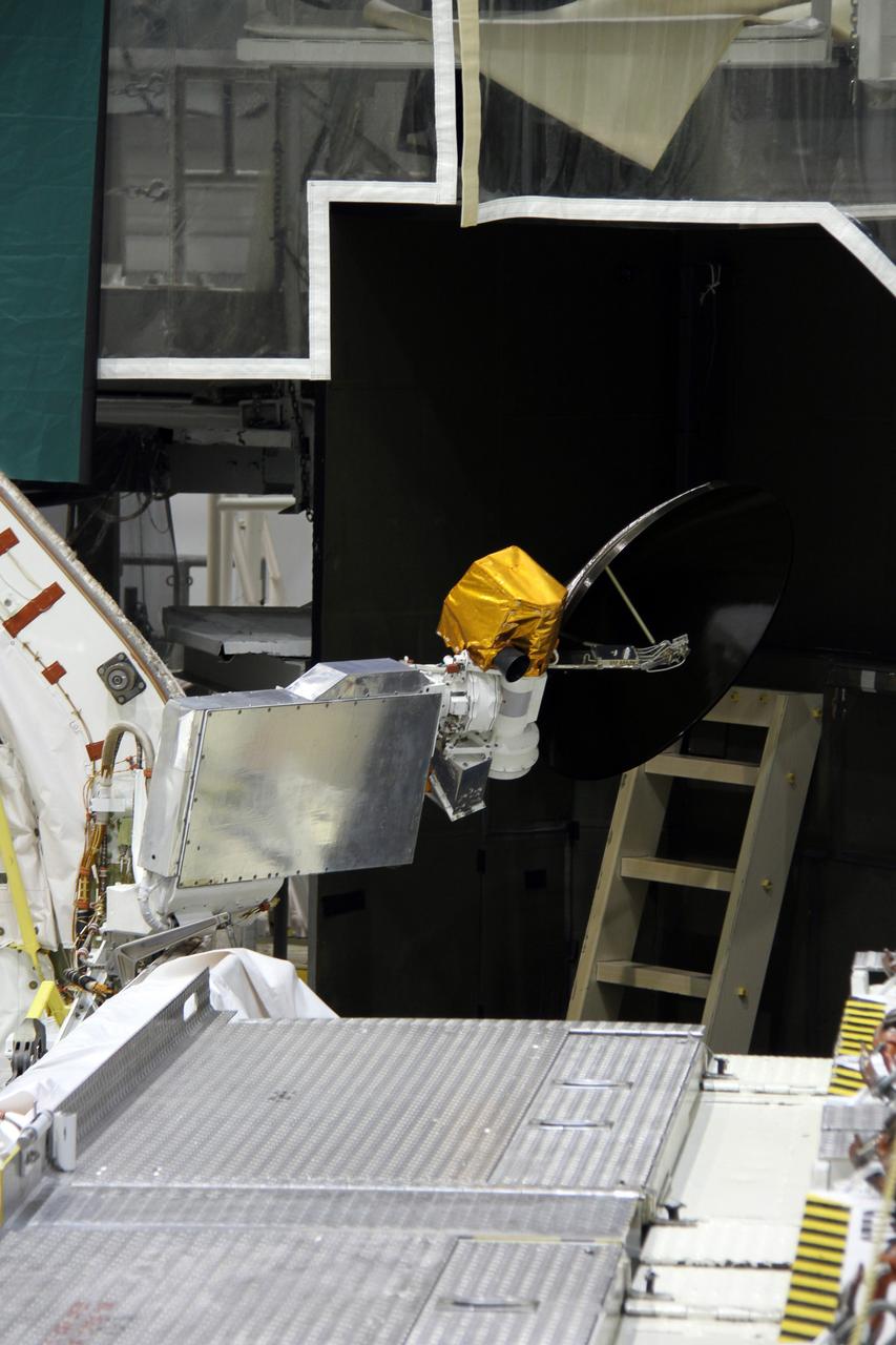 CAPE CANAVERAL, Fla. – In Orbiter Processing Facility-2 at NASA's Kennedy Space Center in Florida, operations are under way to stow a Ku-band antenna in space shuttle Endeavour’s payload bay in preparation for final closure of the shuttle’s payload bay doors. The antenna, which resembles a mini-satellite dish, was used to transmit audio, video and data between the shuttle and ground stations on Earth. Endeavour is being prepared for public display at the California Science Center in Los Angeles. Its ferry flight to California is targeted for mid-September. Endeavour was the last space shuttle added to NASA’s orbiter fleet. Over the course of its 19-year career, Endeavour spent 299 days in space during 25 missions. For more information, visit http://www.nasa.gov/transition. Photo credit: NASA/Cory Huston