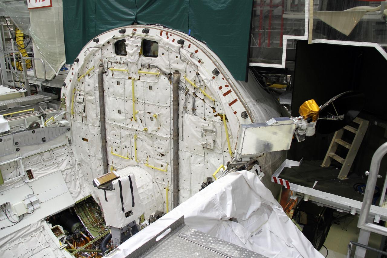 CAPE CANAVERAL, Fla. – In Orbiter Processing Facility-2 at NASA's Kennedy Space Center in Florida, a Ku-band antenna is being stowed in space shuttle Endeavour’s payload bay in preparation for final closure of the shuttle’s payload bay doors. The antenna, which resembles a mini-satellite dish, was used to transmit audio, video and data between the shuttle and ground stations on Earth. Endeavour is being prepared for public display at the California Science Center in Los Angeles. Its ferry flight to California is targeted for mid-September. Endeavour was the last space shuttle added to NASA’s orbiter fleet. Over the course of its 19-year career, Endeavour spent 299 days in space during 25 missions. For more information, visit http://www.nasa.gov/transition. Photo credit: NASA/Cory Huston