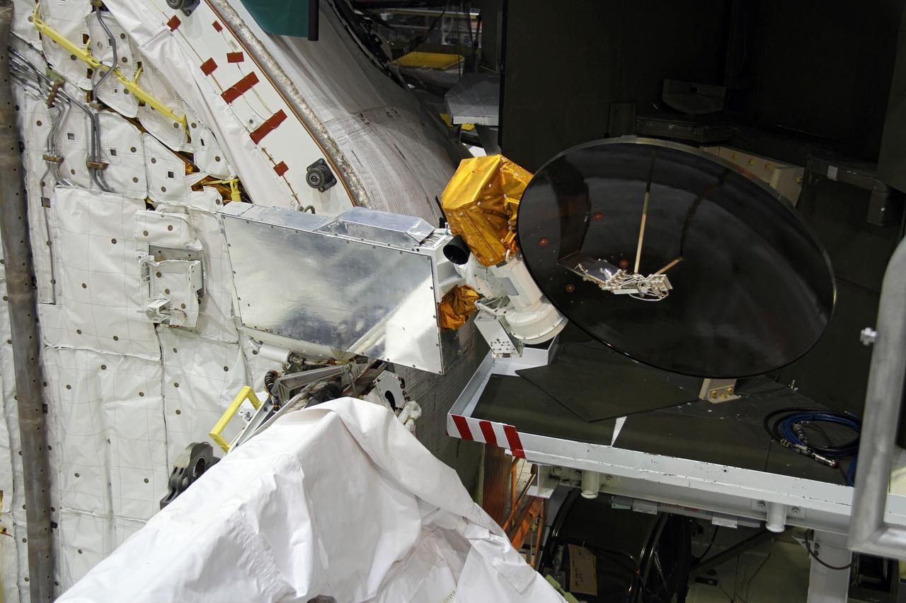 CAPE CANAVERAL, Fla. – In Orbiter Processing Facility-2 at NASA's Kennedy Space Center in Florida, a Ku-band antenna is being stowed in space shuttle Endeavour’s payload bay in preparation for final closure of the shuttle’s payload bay doors. The antenna, which resembles a mini-satellite dish, was used to transmit audio, video and data between the shuttle and ground stations on Earth. Endeavour is being prepared for public display at the California Science Center in Los Angeles. Its ferry flight to California is targeted for mid-September. Endeavour was the last space shuttle added to NASA’s orbiter fleet. Over the course of its 19-year career, Endeavour spent 299 days in space during 25 missions. For more information, visit http://www.nasa.gov/transition. Photo credit: NASA/Cory Huston