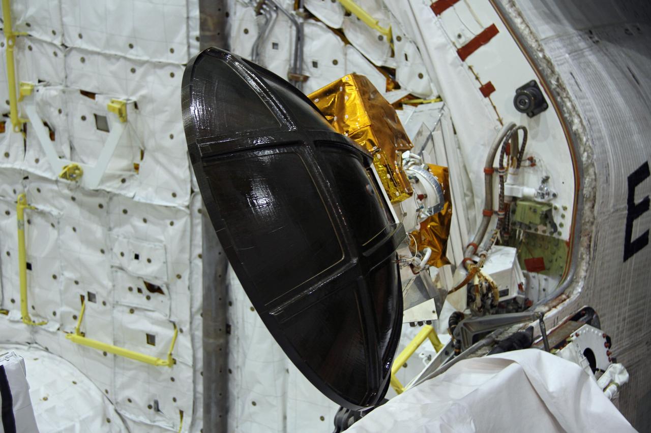 CAPE CANAVERAL, Fla. – In Orbiter Processing Facility-2 at NASA's Kennedy Space Center in Florida, stowage of a Ku-band antenna in space shuttle Endeavour’s payload bay is under way in preparation for final closure of the shuttle’s payload bay doors. The antenna, which resembles a mini-satellite dish, was used to transmit audio, video and data between the shuttle and ground stations on Earth. Endeavour is being prepared for public display at the California Science Center in Los Angeles. Its ferry flight to California is targeted for mid-September. Endeavour was the last space shuttle added to NASA’s orbiter fleet. Over the course of its 19-year career, Endeavour spent 299 days in space during 25 missions. For more information, visit http://www.nasa.gov/transition. Photo credit: NASA/Cory Huston