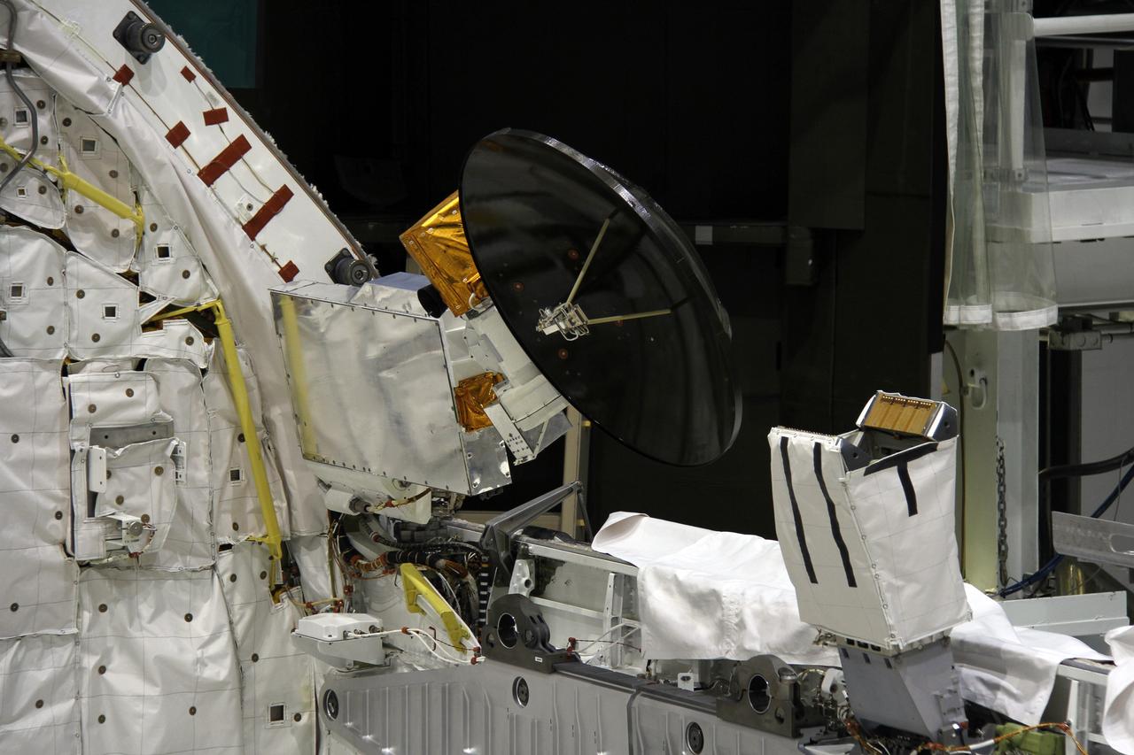 CAPE CANAVERAL, Fla. – In Orbiter Processing Facility-2 at NASA's Kennedy Space Center in Florida, a Ku-band antenna is stowed at the forward end of space shuttle Endeavour’s payload bay in preparation for final closure of the shuttle’s payload bay doors. The antenna, which resembles a mini-satellite dish, was used to transmit audio, video and data between the shuttle and ground stations on Earth. Endeavour is being prepared for public display at the California Science Center in Los Angeles. Its ferry flight to California is targeted for mid-September. Endeavour was the last space shuttle added to NASA’s orbiter fleet. Over the course of its 19-year career, Endeavour spent 299 days in space during 25 missions. For more information, visit http://www.nasa.gov/transition. Photo credit: NASA/Cory Huston