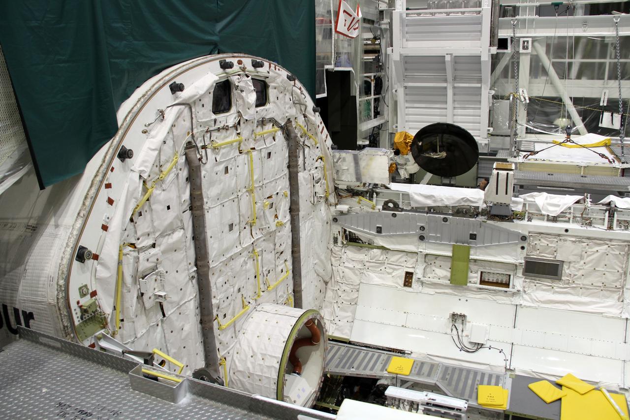 CAPE CANAVERAL, Fla. – In Orbiter Processing Facility-2 at NASA's Kennedy Space Center in Florida, a Ku-band antenna is stowed at the forward end of space shuttle Endeavour’s payload bay in preparation for final closure of the shuttle’s payload bay doors. The antenna, which resembles a mini-satellite dish, was used to transmit audio, video and data between the shuttle and ground stations on Earth. Endeavour is being prepared for public display at the California Science Center in Los Angeles. Its ferry flight to California is targeted for mid-September. Endeavour was the last space shuttle added to NASA’s orbiter fleet. Over the course of its 19-year career, Endeavour spent 299 days in space during 25 missions. For more information, visit http://www.nasa.gov/transition. Photo credit: NASA/Cory Huston