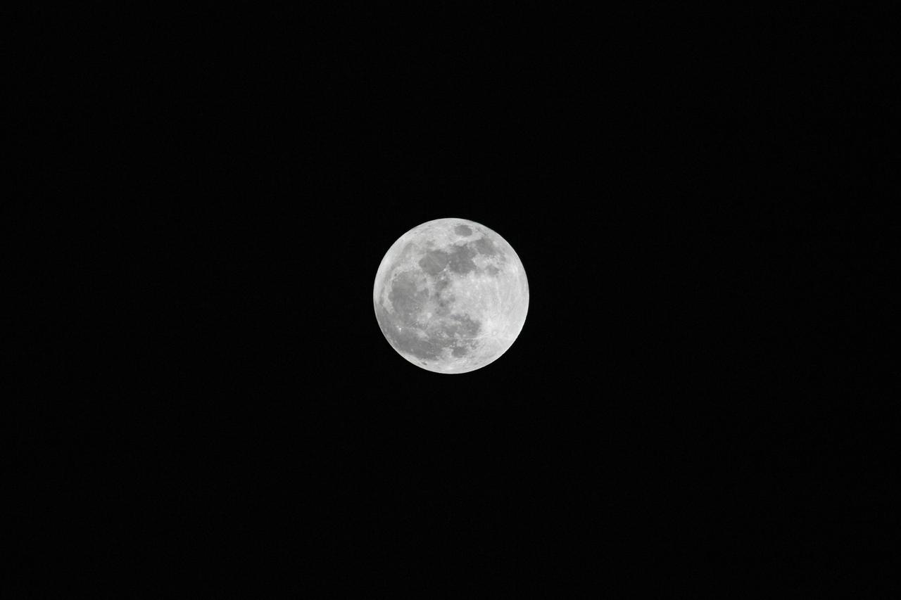 CAPE CANAVERAL, Fla. – A view of the super moon in the eastern sky over Kennedy Space Center in Florida. The full moon reached perigee, the closest point to Earth in its elliptical pattern, at 11:34 p.m. It appeared 14 percent larger and 30 percent brighter than other full moons of 2012. Photo credit: NASA/Jim Grossmann