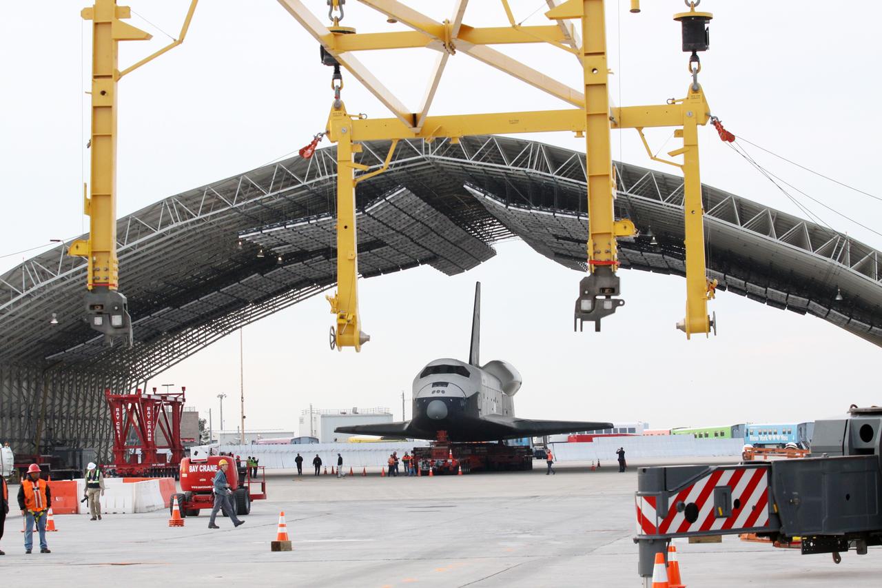NEW YORK – Space shuttle Enterprise is backed into a protective hangar at John F. Kennedy International Airport in New York City. Enterprise, a prototype built to test aspects of the space shuttle design, will be displayed at the Intrepid Sea, Air and Space Museum in New York. Photo credit: NASA/Kim Shiflett