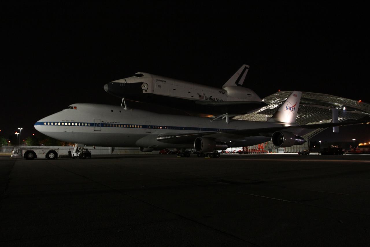 NEW YORK – NASA's shuttle carrier aircraft is moved into place so the space shuttle Enterprise can be removed. The work took place at John F. Kennedy International Airport in New York City. Enterprise, a prototype built to test aspects of the space shuttle design, will be displayed at the Intrepid Sea, Air and Space Museum in New York. Photo credit: NASA/Kim Shiflett