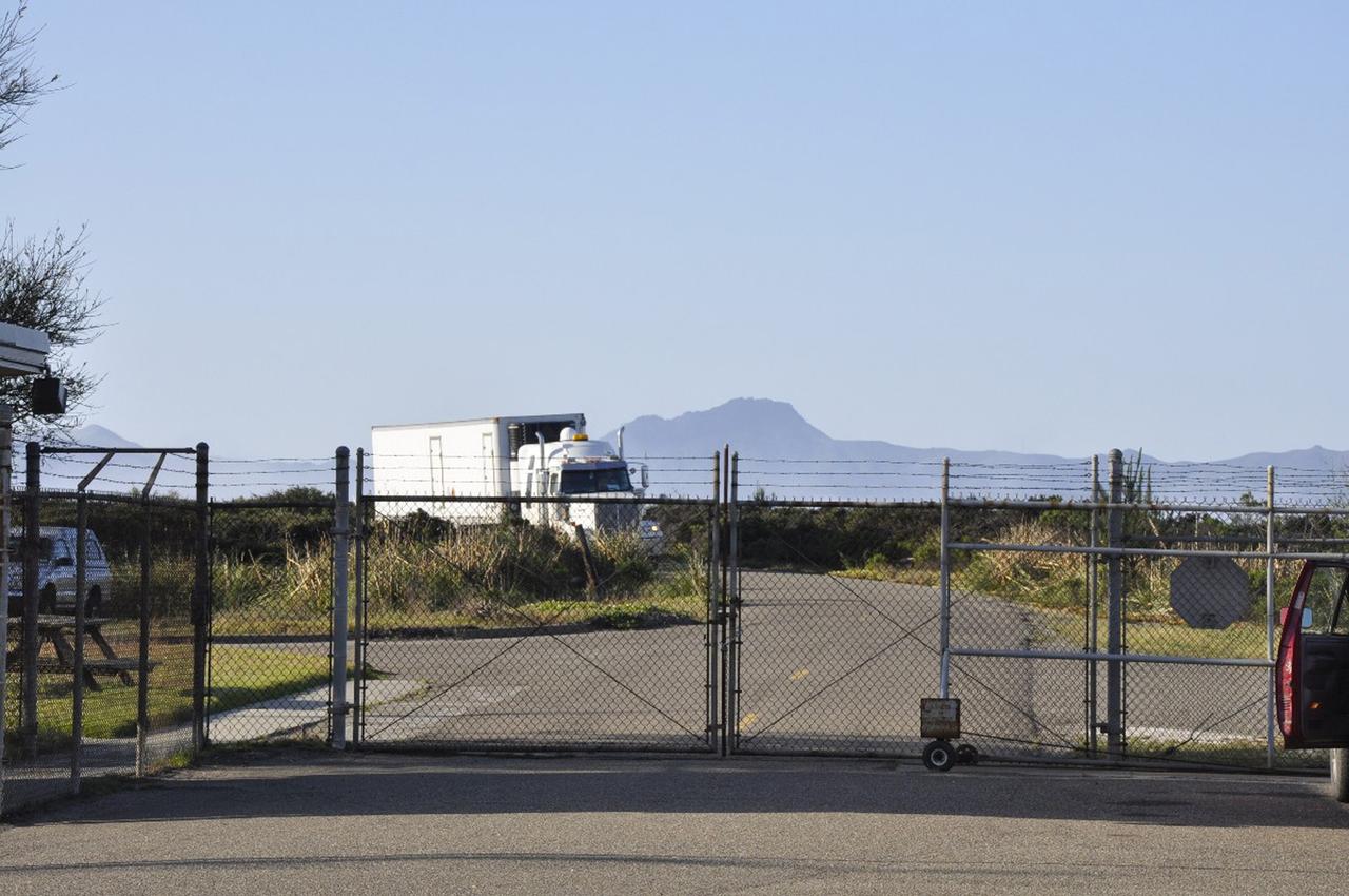 Vandenberg Air Force Base, Calif. – A truck carrying all three stages of the Orbital Sciences Pegasus XL rocket arrives at Vandenberg Air Force Base in California.     NASA’s Interface Region Imaging Spectrograph, or IRIS, spacecraft will launch aboard the Pegasus XL in late 2012. IRIS will open a new window of discovery by tracing the flow of energy and plasma through the chromospheres and transition region into the sun’s corona using spectrometry and imaging.  IRIS fills a crucial gap in our ability to advance studies of the sun-to-Earth connection by tracing the flow of energy and plasma through the foundation of the corona and heliosphere, or region around the sun. Photo credit: NASA/Randy Beaudoin