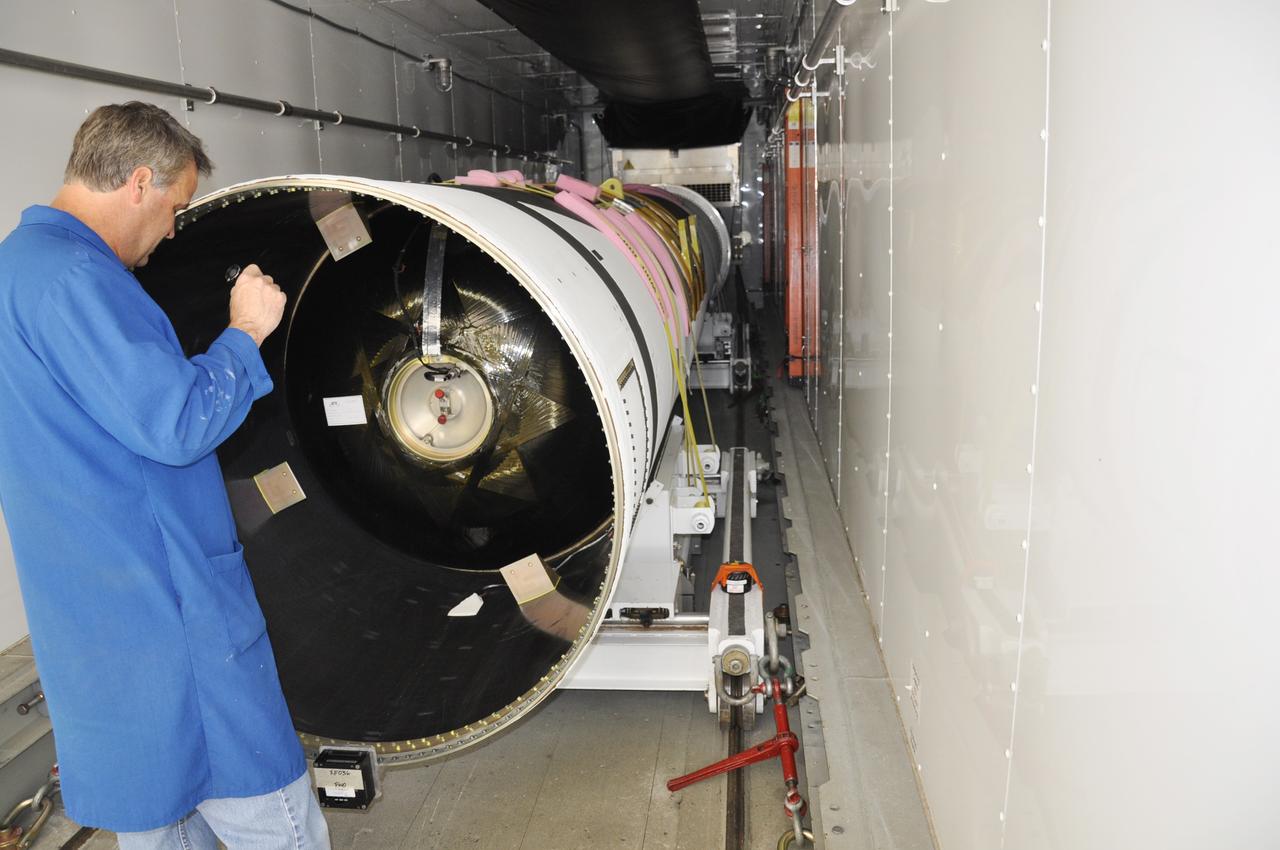 Vandenberg Air Force Base, Calif. – At Vandenberg Air Force Base in California, technicians prepare to offload the first stage of the Orbital Sciences Pegasus XL rocket from the truck in which it was transported.      NASA’s Interface Region Imaging Spectrograph, or IRIS, spacecraft will launch aboard the Pegasus XL in late 2012. IRIS will open a new window of discovery by tracing the flow of energy and plasma through the chromospheres and transition region into the sun’s corona using spectrometry and imaging.  IRIS fills a crucial gap in our ability to advance studies of the sun-to-Earth connection by tracing the flow of energy and plasma through the foundation of the corona and heliosphere, or region around the sun. Photo credit: NASA/Randy Beaudoin