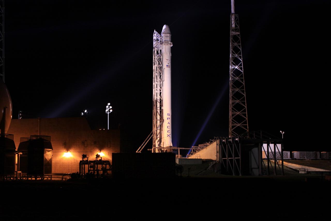 CAPE CANAVERAL, Fla. – A strongback lifts the SpaceX Falcon 9 rocket into a vertical position on the pad at Space Launch Complex-40 on Cape Canaveral Air Force Station in Florida.      Liftoff with the SpaceX Dragon capsule aboard is set for 4:55 a.m. EDT on May 19. The launch will be the company's second demonstration test flight for NASA's Commercial Orbital Transportation Services Program, or COTS. During the flight, the capsule will conduct a series of check-out procedures to test and prove its systems, including rendezvous and berthing with the International Space Station. If the capsule performs as planned, the cargo and experiments it is carrying will be transferred to the station. The cargo includes food, water and provisions for the station’s Expedition crews, such as clothing, batteries and computer equipment. Under COTS, NASA has partnered with two aerospace companies to deliver cargo to the station. For more information, visit http://www.nasa.gov/spacex.  Photo credit: NASA/Jim Grossmann