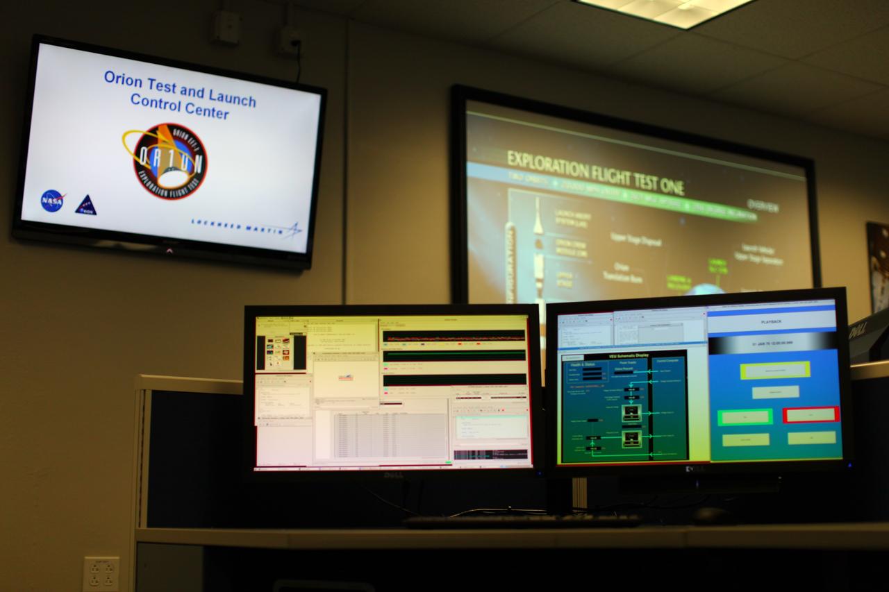 CAPE CANAVERAL, Fla. – Inside the Operations and Checkout Building at NASA’s Kennedy Space Center in Florida, media tour the new Orion Test and Launch Control Center. During a tour of the facility, media representatives viewed Orion, several processing stations, and the Orion Test and Launch Control Center. The ground test vehicle will remain at Kennedy for acoustic and modal testing. The heat shield on the bottom of the module will be removed and replaced with a more flight-like heat shield that was built by Lockheed Martin in Denver and will be shipped to Kennedy for installation. The test vehicle will then be in its vehicle configuration for the splashdown test at Langley as NASA prepares for Exploration Flight Test-1. Photo credit: NASA/Frankie Martin