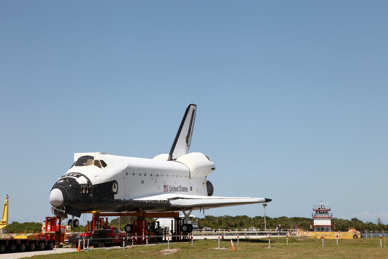 CAPE CANAVERAL, Fla. – The high-fidelity space shuttle model awaits to be loaded onto a barge at Kennedy Space Center’s Launch Complex 39 turn basin in Florida. The model is being transported from Kennedy to Space Center Houston, NASA Johnson Space Center's visitor center. The model will be transported via barge to Texas. The model was built in Apopka, Fla., by Guard-Lee and installed at the Kennedy Space Center Visitor Complex in 1993.The model has been parked at the turn basin the past five months to allow the Kennedy Space Center Visitor Complex to begin building a new facility to display space shuttle Atlantis in 2013. For more information about Space Center Houston, visit http://www.spacecenter.org. Photo credit: NASA/Frankie Martin