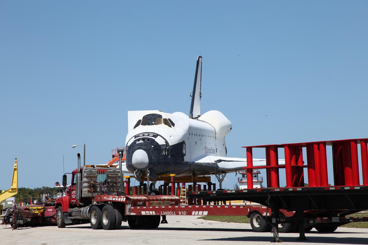 CAPE CANAVERAL, Fla. – The high-fidelity space shuttle model awaits to be loaded onto a barge at Kennedy Space Center’s Launch Complex 39 turn basin in Florida. The model is being transported from Kennedy to Space Center Houston, NASA Johnson Space Center's visitor center. The model will be transported via barge to Texas. The model was built in Apopka, Fla., by Guard-Lee and installed at the Kennedy Space Center Visitor Complex in 1993.The model has been parked at the turn basin the past five months to allow the Kennedy Space Center Visitor Complex to begin building a new facility to display space shuttle Atlantis in 2013. For more information about Space Center Houston, visit http://www.spacecenter.org. Photo credit: NASA/Frankie Martin