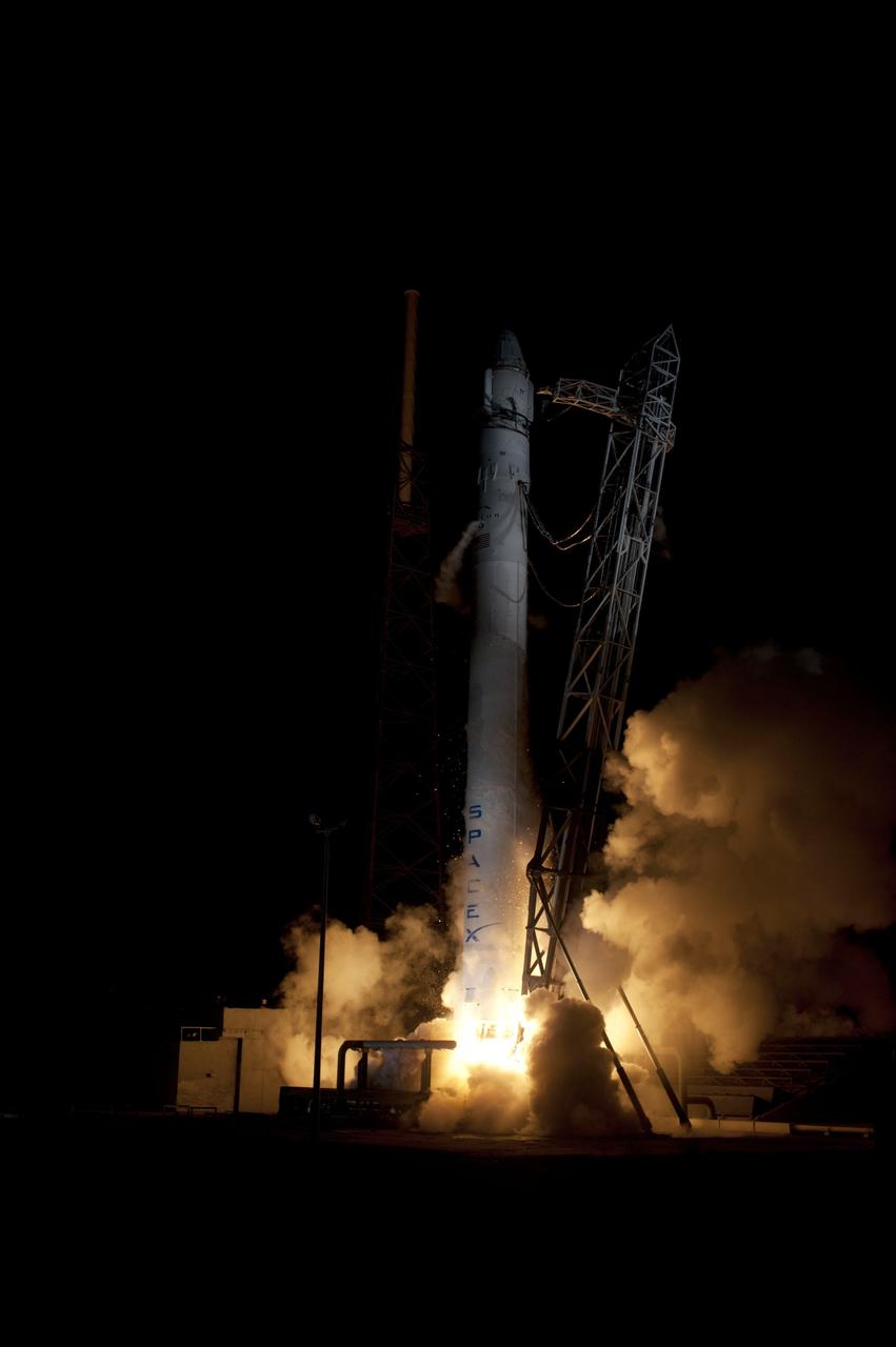 CAPE CANAVERAL, Fla. – An exhaust cloud begins to form around the SpaceX Falcon 9 rocket as it lifts off Space Launch Complex-40 on Cape Canaveral Air Force Station in Florida at 3:44 a.m. EDT.    The launch is the company's second demonstration test flight for NASA's Commercial Orbital Transportation Services, or COTS, Program. During the flight, the Dragon capsule will conduct a series of check-out procedures to test and prove its systems, including rendezvous and berthing with the International Space Station.  If the capsule performs as planned, the cargo and experiments it is carrying will be transferred to the station. The cargo includes food, water and provisions for the station’s Expedition crews, such as clothing, batteries and computer equipment. Under COTS, NASA has partnered with two aerospace companies to deliver cargo to the station. For more information, visit http://www.nasa.gov/spacex.  Photo credit: NASA/Rick Wetherington, Tim Powers and Tim Terry