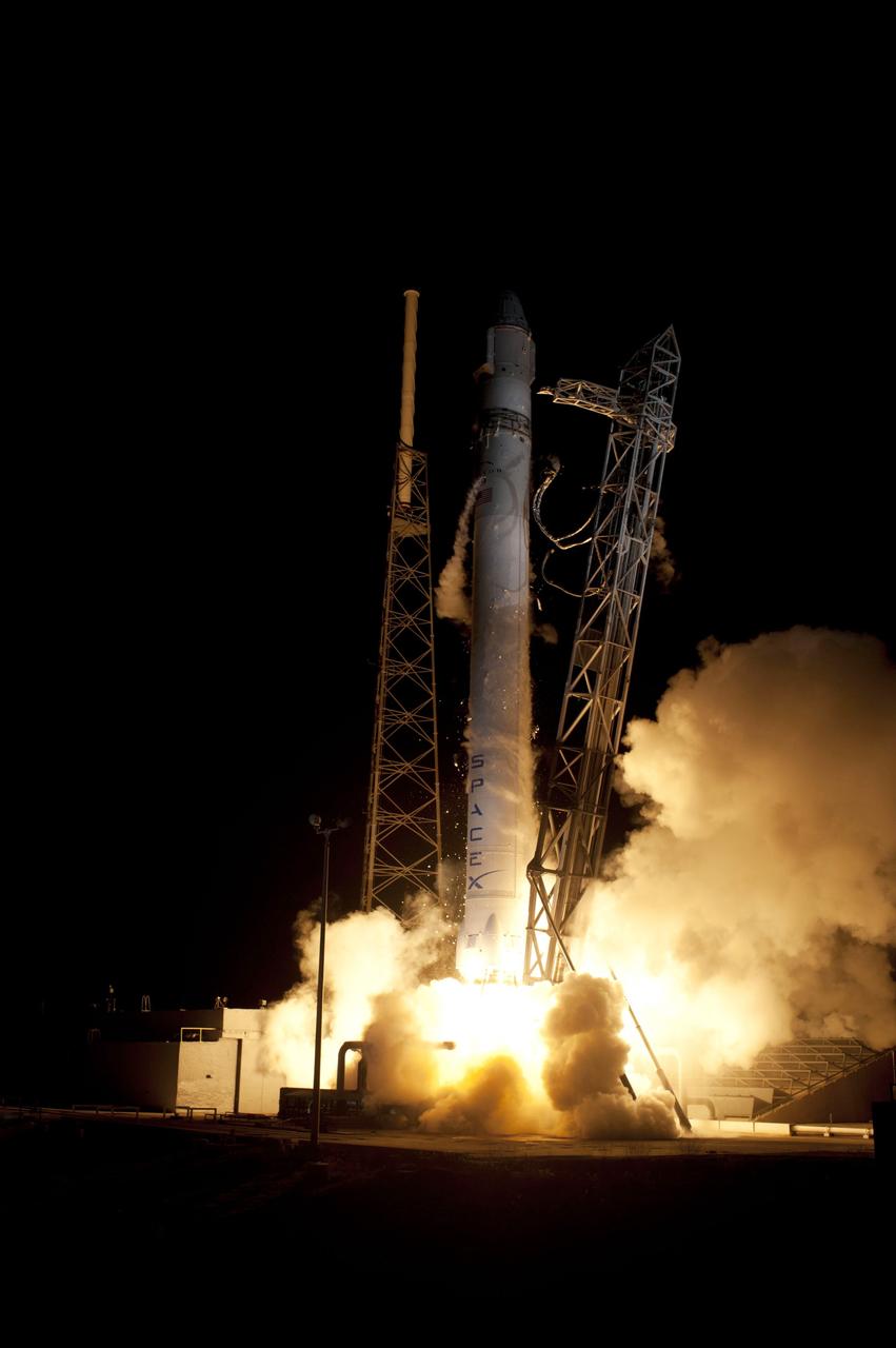 CAPE CANAVERAL, Fla. – The SpaceX Falcon 9 rocket begins to lift off from Space Launch Complex-40 on Cape Canaveral Air Force Station in Florida at 3:44 a.m. EDT.     The launch is the company's second demonstration test flight for NASA's Commercial Orbital Transportation Services, or COTS, Program. During the flight, the Dragon capsule will conduct a series of check-out procedures to test and prove its systems, including rendezvous and berthing with the International Space Station.  If the capsule performs as planned, the cargo and experiments it is carrying will be transferred to the station. The cargo includes food, water and provisions for the station’s Expedition crews, such as clothing, batteries and computer equipment. Under COTS, NASA has partnered with two aerospace companies to deliver cargo to the station. For more information, visit http://www.nasa.gov/spacex.  Photo credit: NASA/Rick Wetherington, Tim Powers and Tim Terry