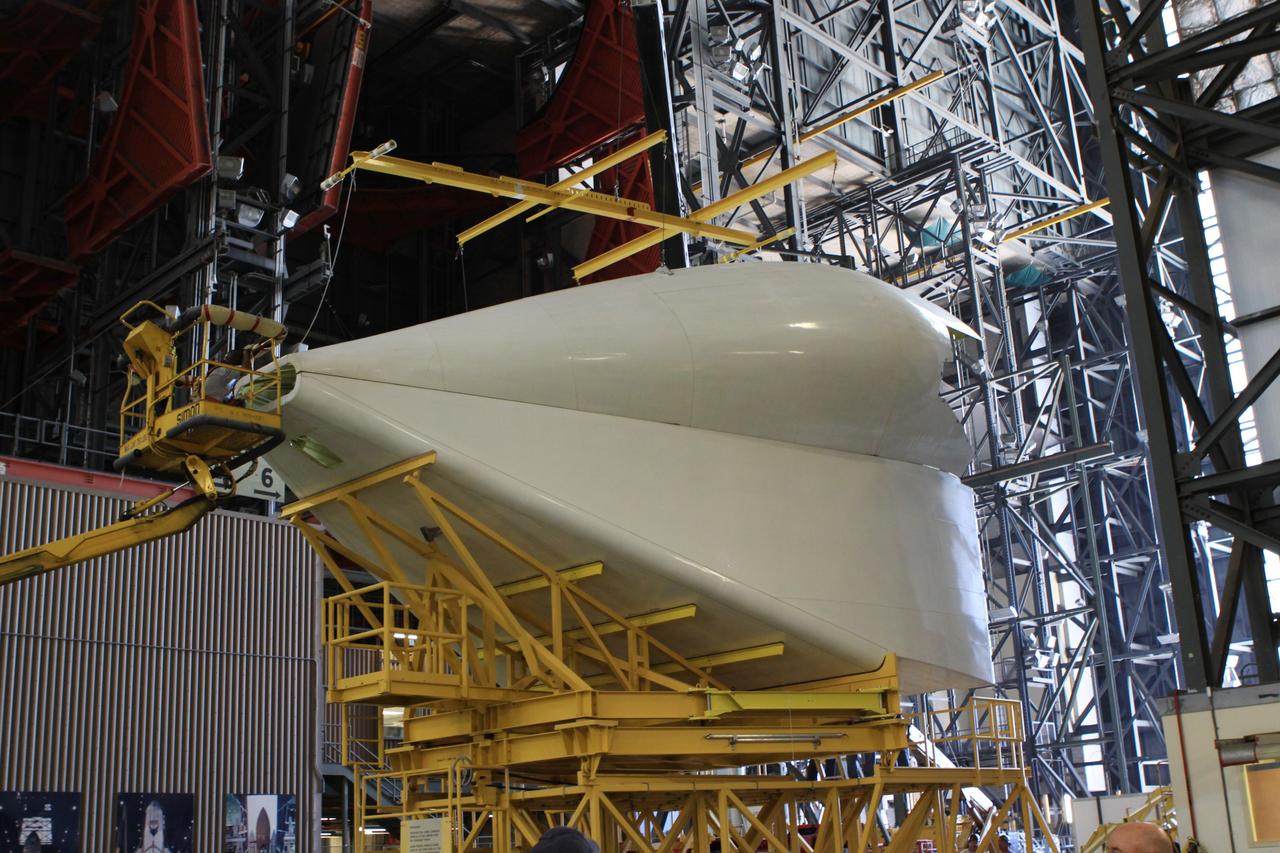 CAPE CANAVERAL, Fla. – In the transfer isle of the Vehicle Assembly Building at NASA’s Kennedy Space Center in Florida, technicians finish building the tail cone that will be installed around space shuttle Endeavour’s three replica shuttle main engines for protection. The tail cone protects the main engines during ferry flights on top of the Shuttle Carrier Aircraft, or SCA. The work is part of the Space Shuttle Program’s transition and retirement processing of shuttle Endeavour.           Endeavour is being prepared for public display at the California Science Center in Los Angeles. Its ferry flight to California is targeted for mid-September. Endeavour was the last space shuttle added to NASA’s orbiter fleet. Over the course of its 19-year career, Endeavour spent 299 days in space during 25 missions. For more information, visit http://www.nasa.gov/shuttle. Photo credit: NASA/Jim Grossmann