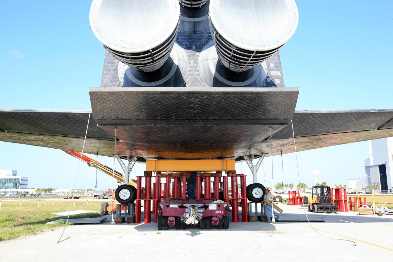 CAPE CANAVERAL, Fla. – Workers secure the high-fidelity space shuttle model to the structure that will cradle the model on its journey from NASA’s Kennedy Space Center in Florida to Johnson Space Center's visitor center in Houston atop a barge.        The model was built in Apopka, Fla., by Guard-Lee and installed at Kennedy Space Center Visitor Complex in 1993.The model has been parked at the turn basin the past five months to allow the Kennedy Space Center Visitor Complex to begin building a new facility next year to display space shuttle Atlantis in 2013. For more information about Johnson’s visitor center, called Space Center Houston, visit http://www.spacecenter.org. Photo credit: NASA/Amanda Diller